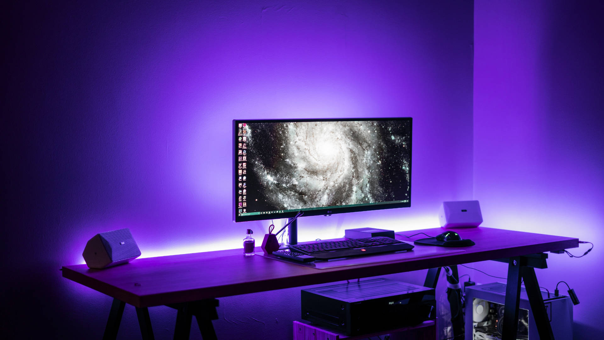 A High-end Gaming Setup In A Purple Themed Room Background