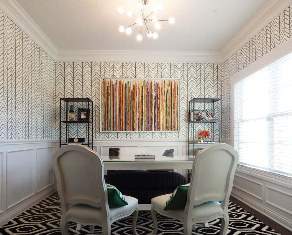 A Home Office With A Black And White Rug And Chairs Background