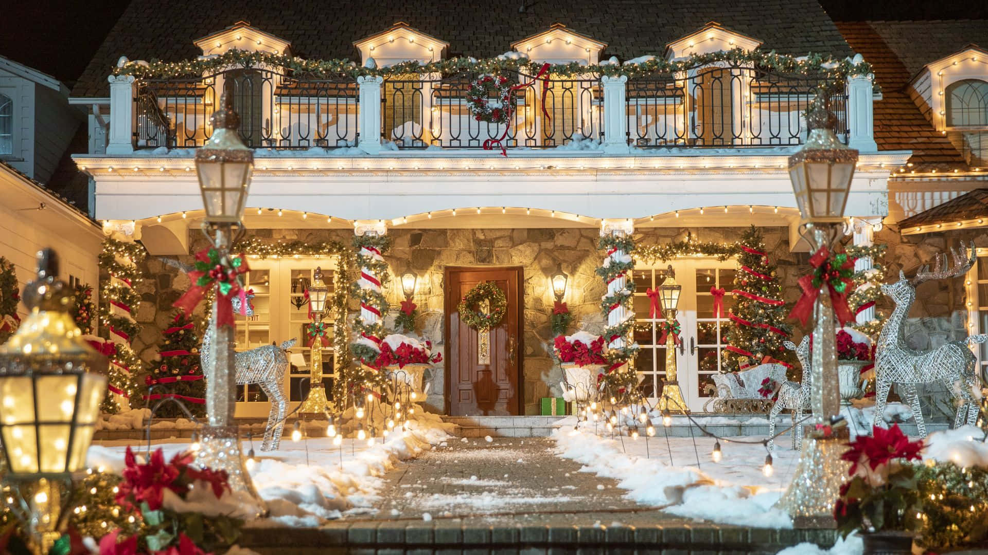 A House Decorated For Christmas With Lights And Decorations Background