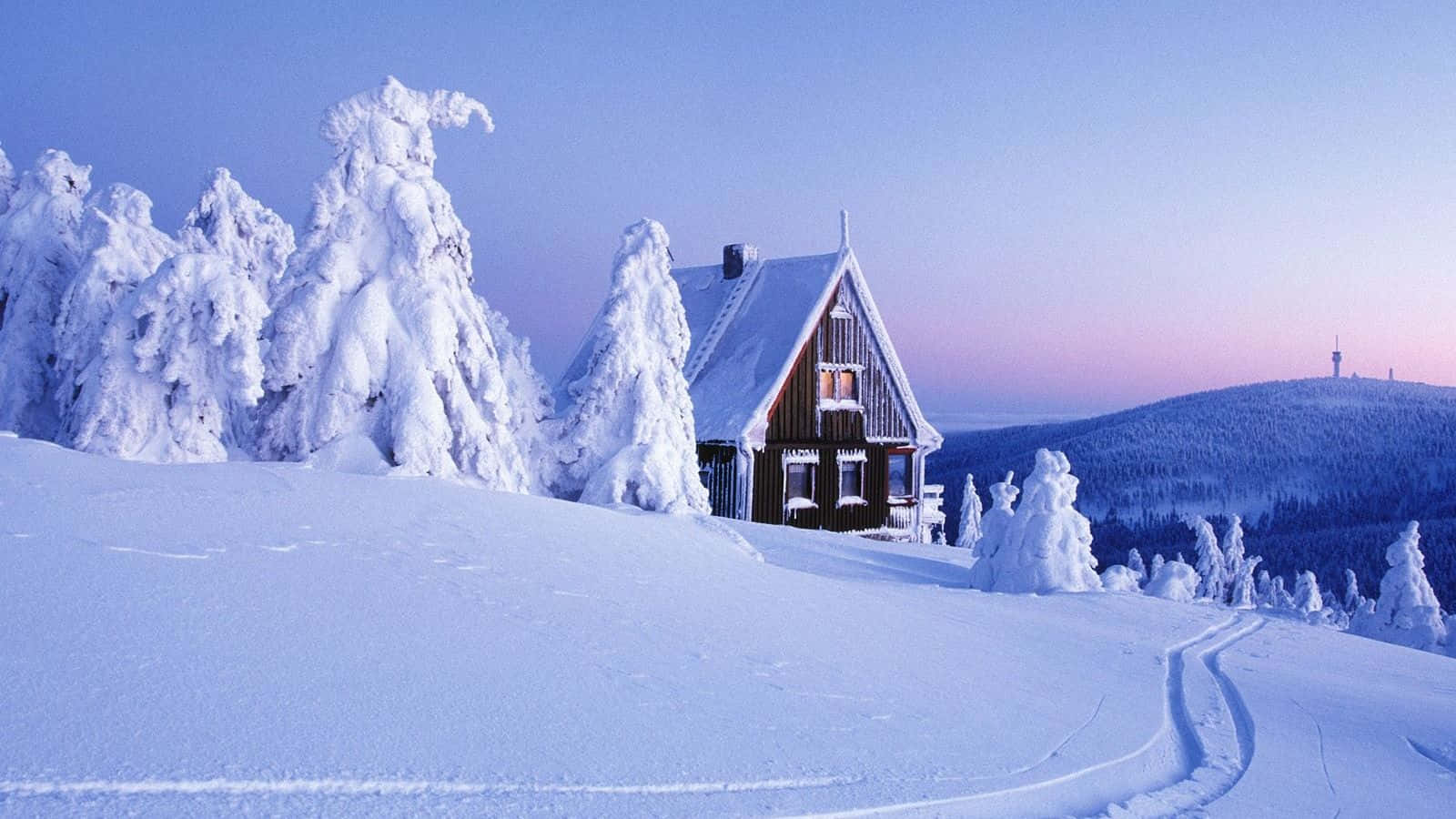 A House Is Covered In Snow On A Snowy Hill Background