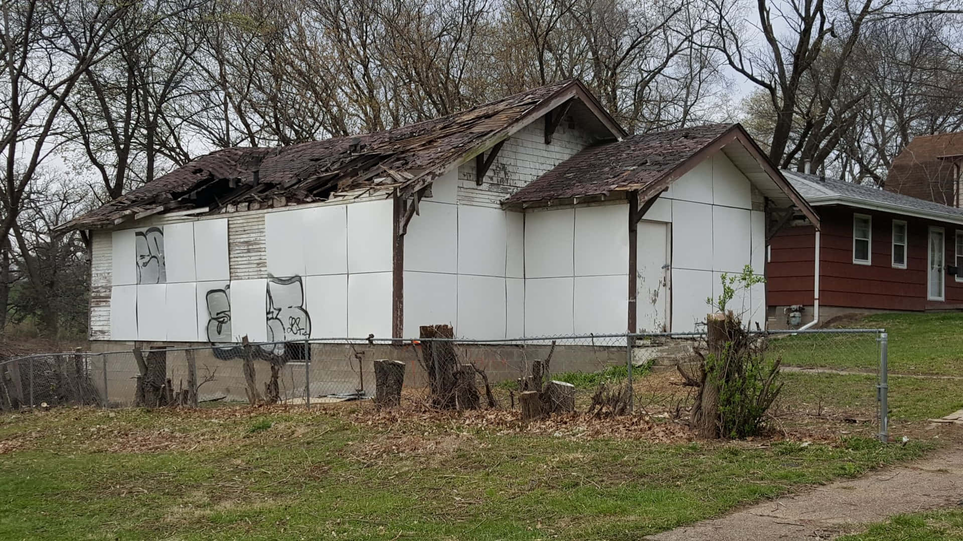 A House With A Fence And A Fence In The Background