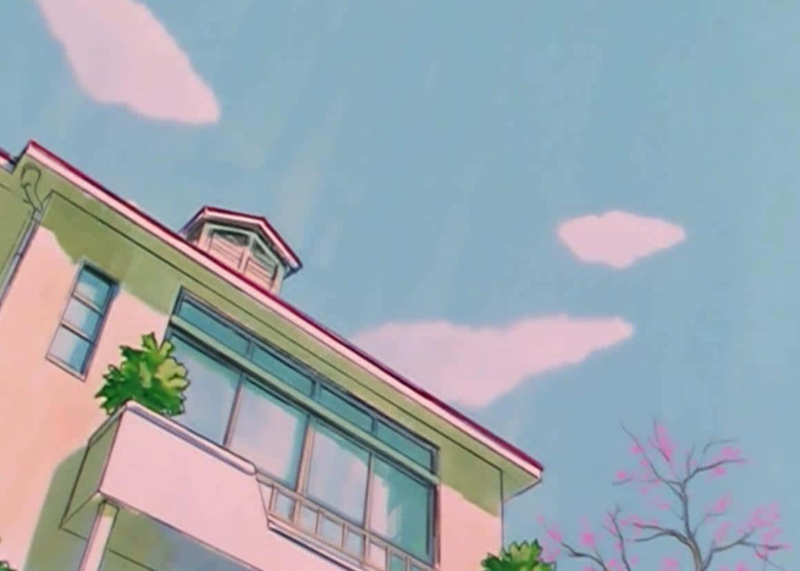 A House With A Pink Roof And A Blue Sky Background