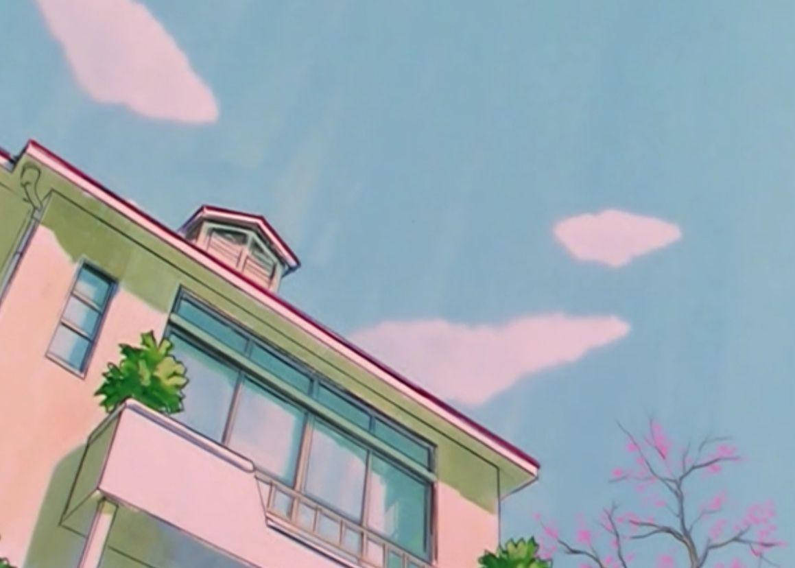 A House With A Pink Roof And A Blue Sky