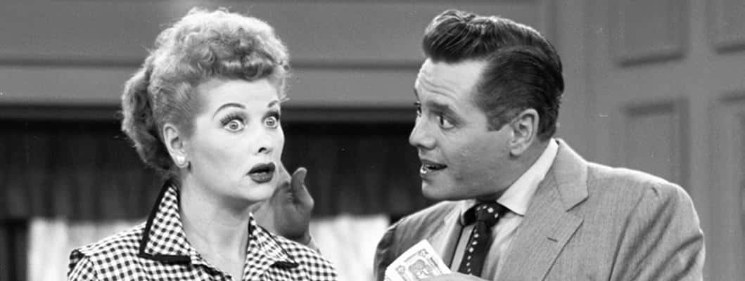 A Humorous Still From I Love Lucy Depicting Lucy, Ricky And Fred Background
