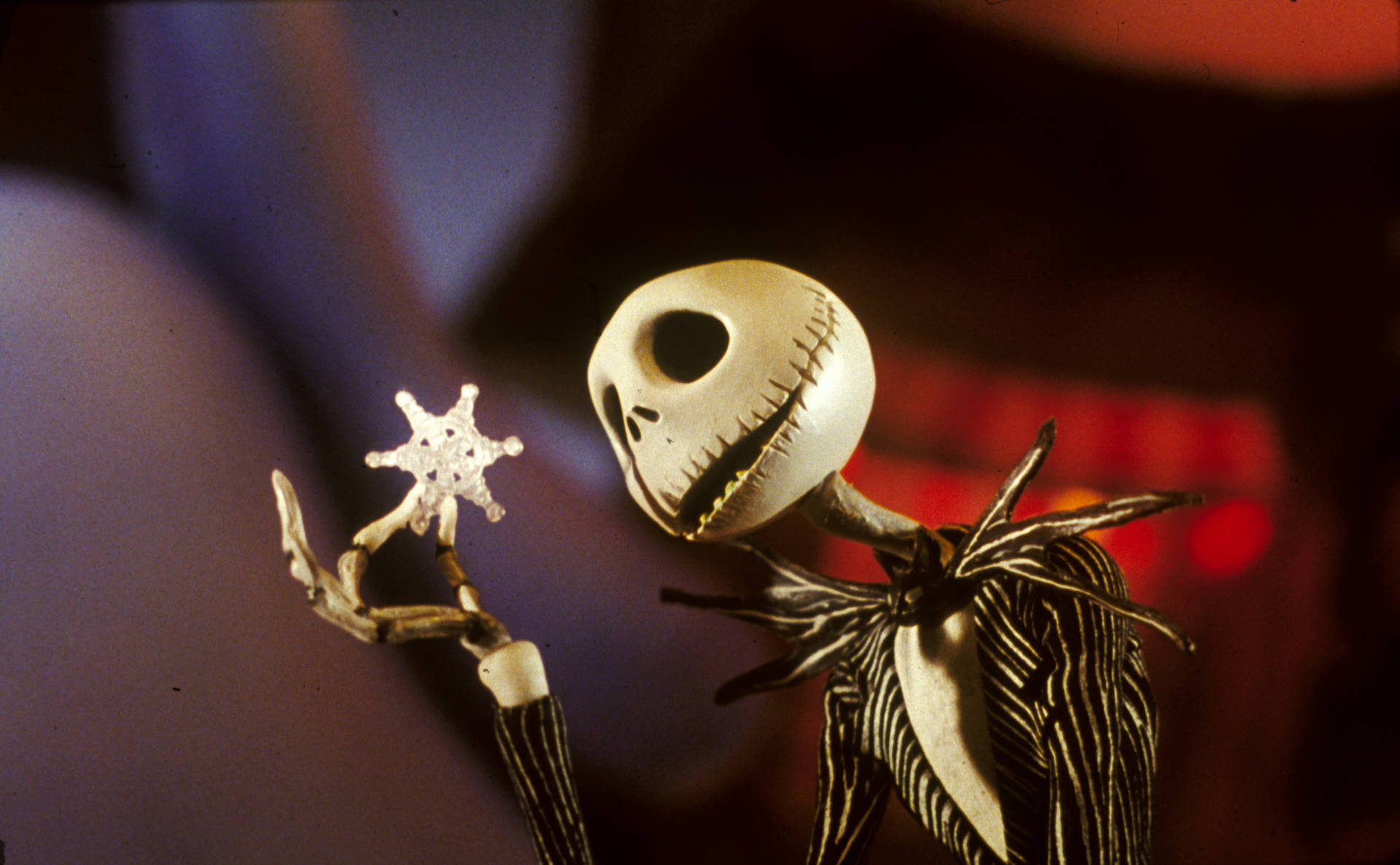 A Jack Skellington Holding A Star Background