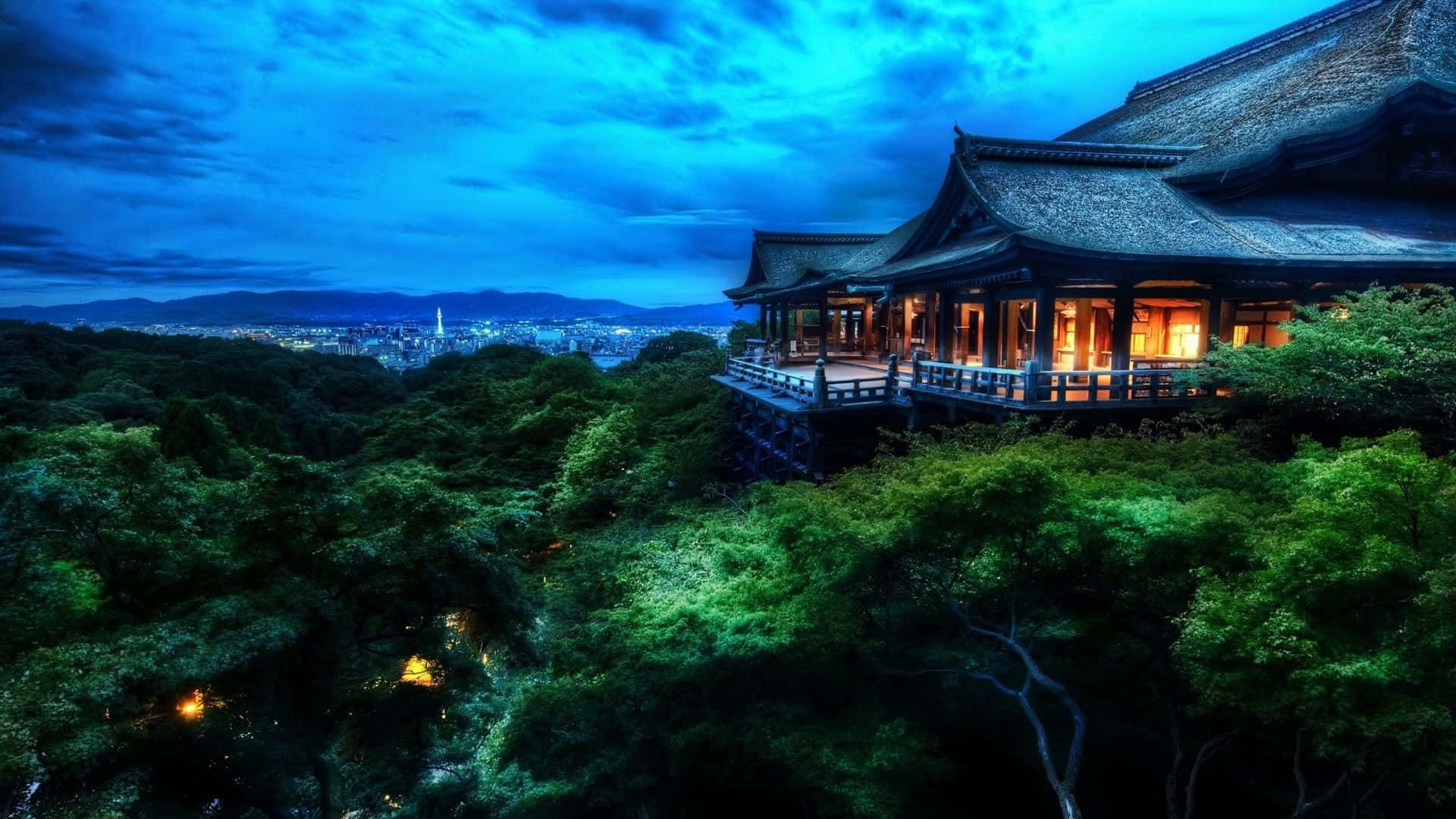 A Japanese Temple Lit Up At Night Background