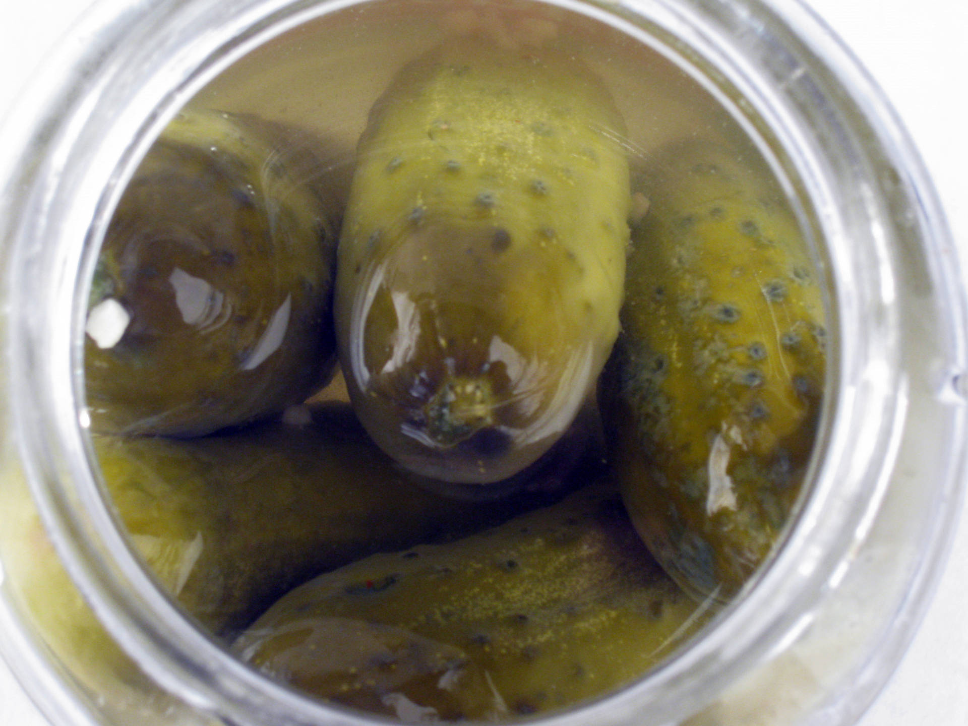 A Jar Full Of Crunchy Pickled Cucumbers Background