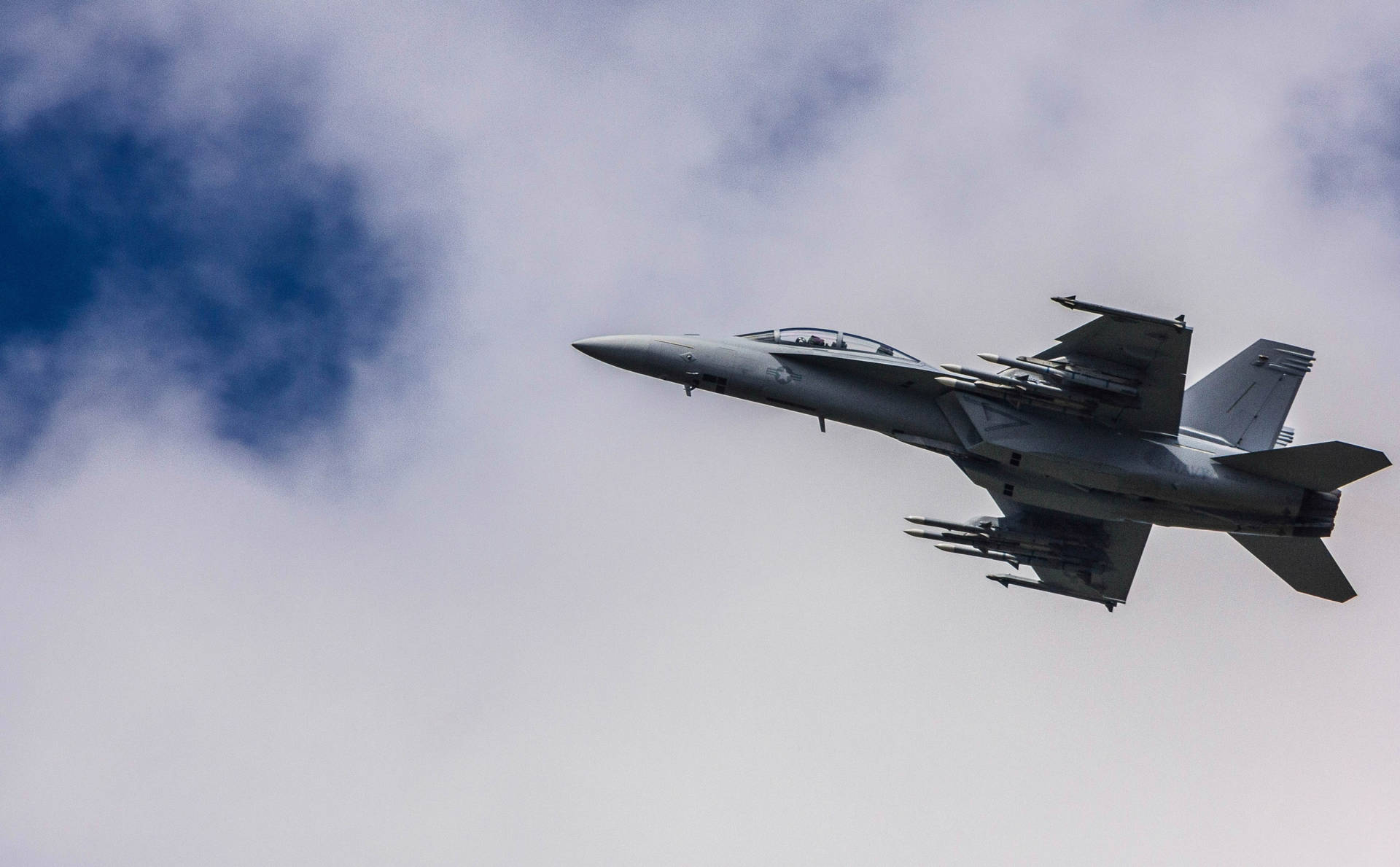 A Jet Flying In The Sky Background