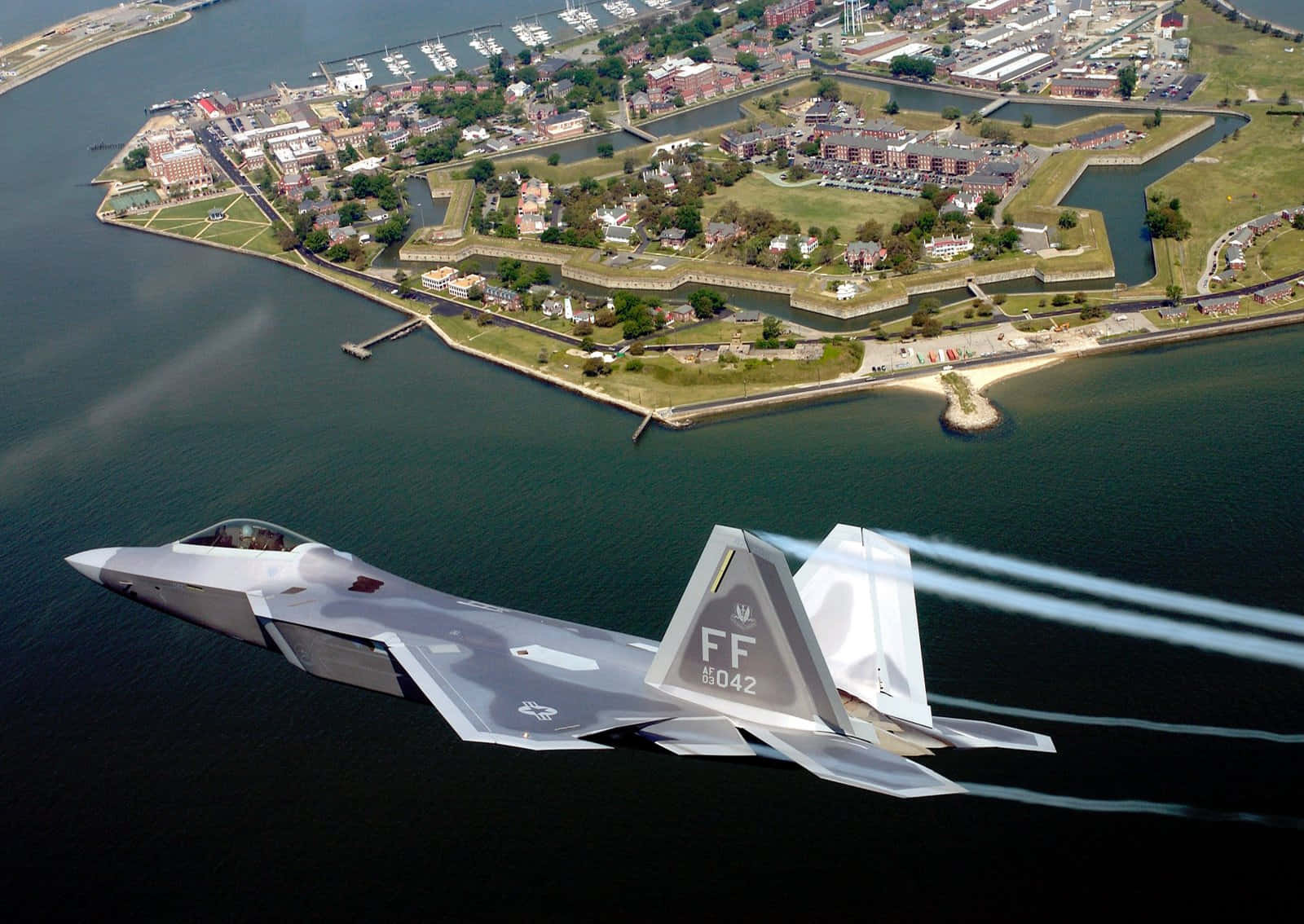 A Jet Flying Over A City Background