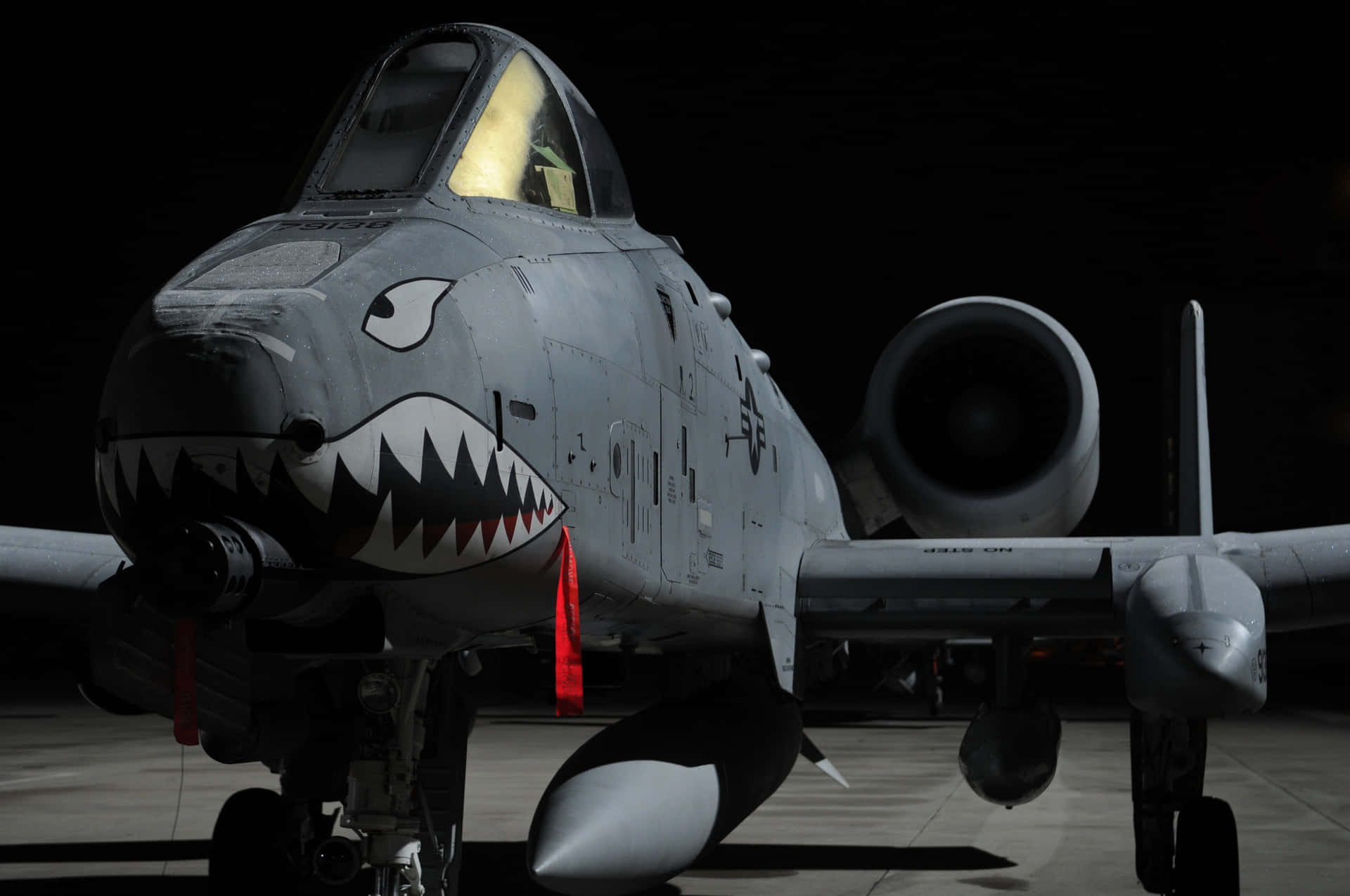 A Jet With A Shark Mouth Background