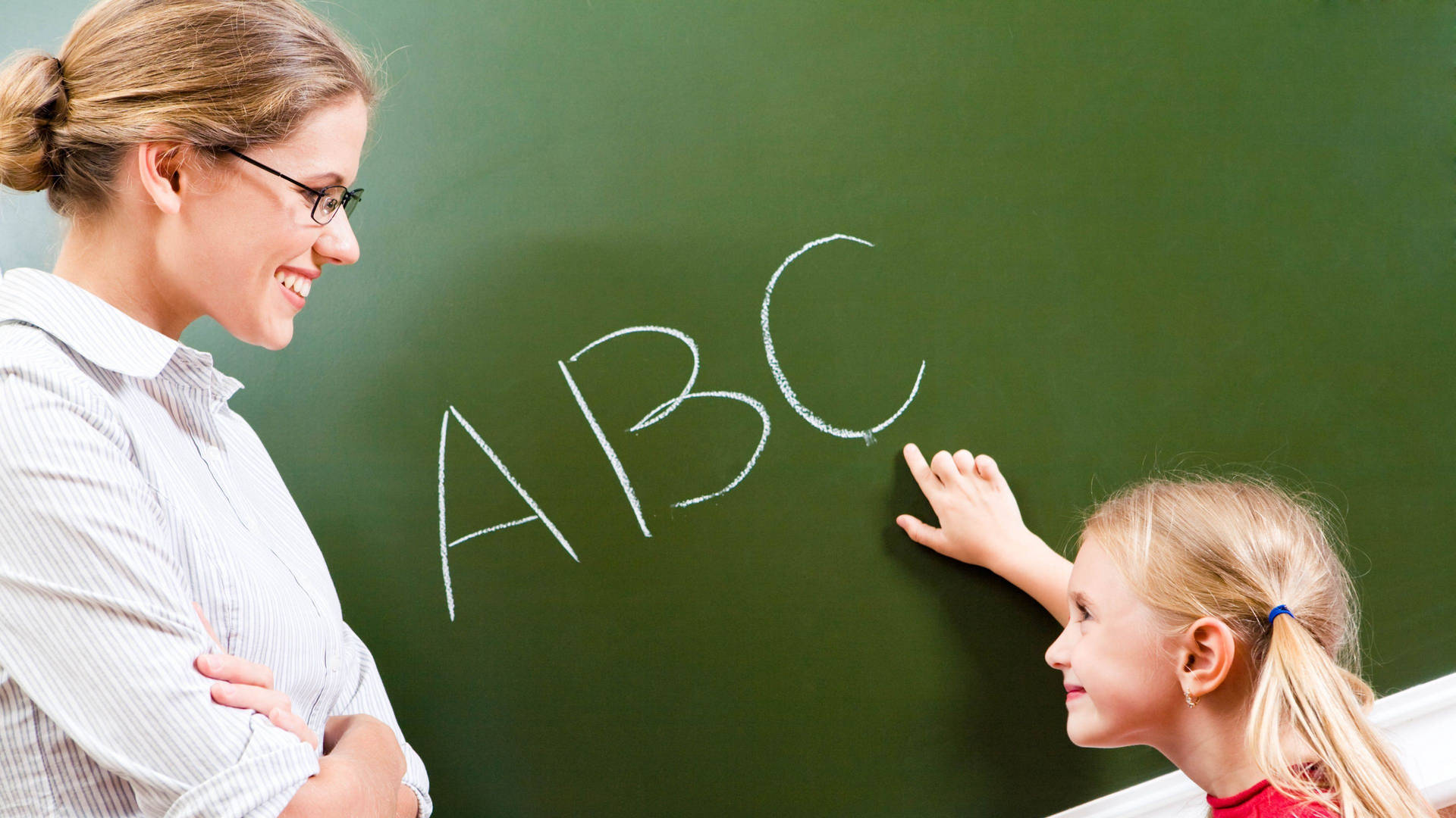 A Joyous Learning Moment: Teacher Guiding Student In Reading Alphabet. Background