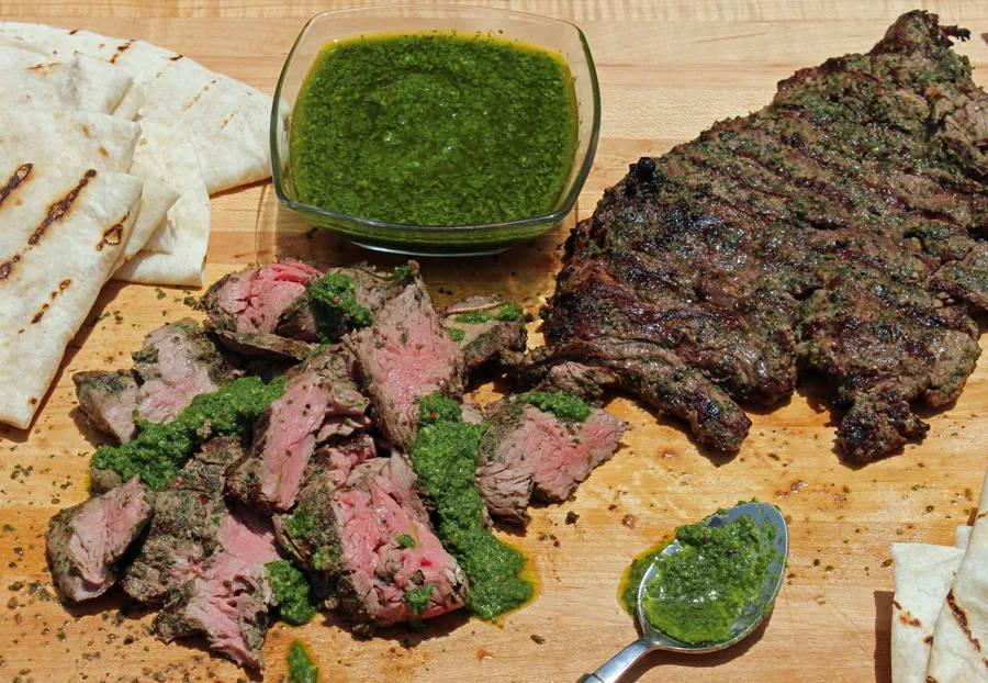 A Juicy Churrasco Steak Served With Flavorful Chimichurri Sauce. Background