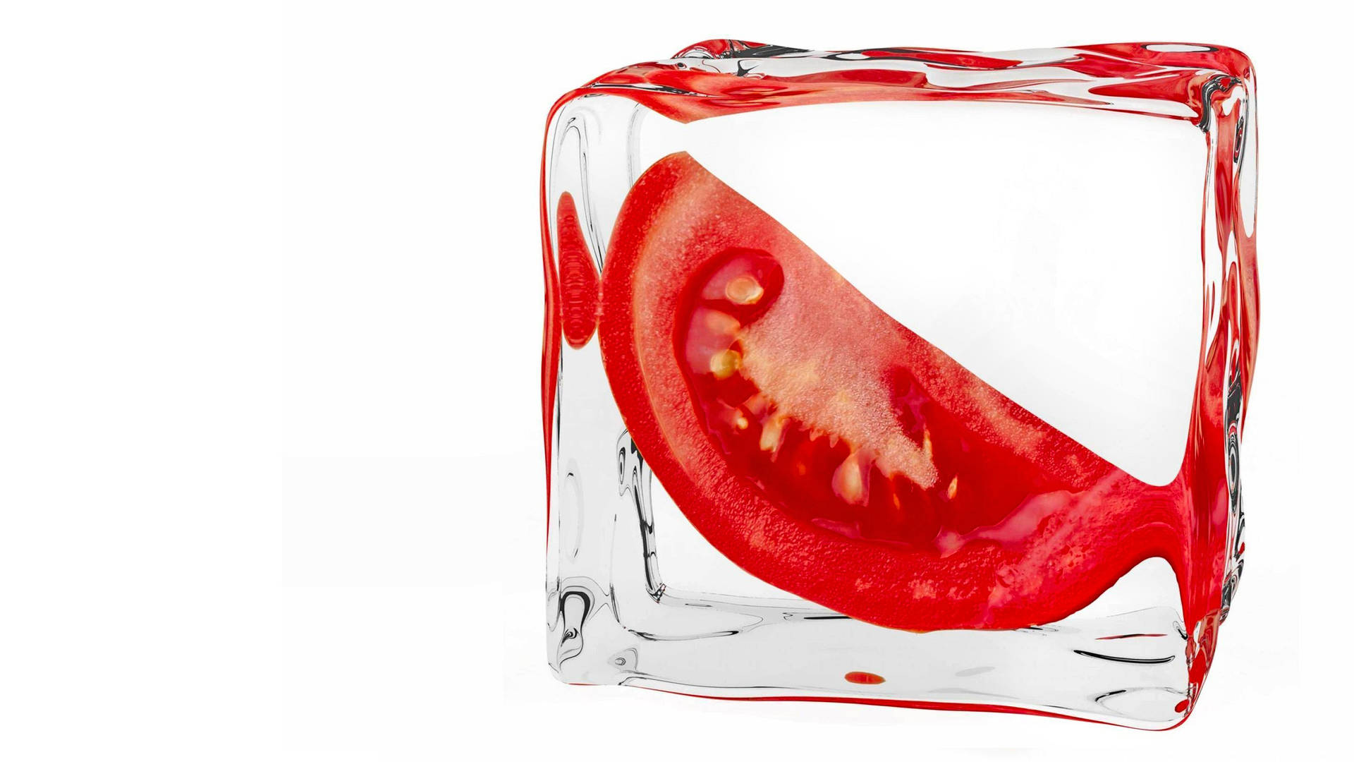 A Juicy Slice Of Fresh Tomato On Ice