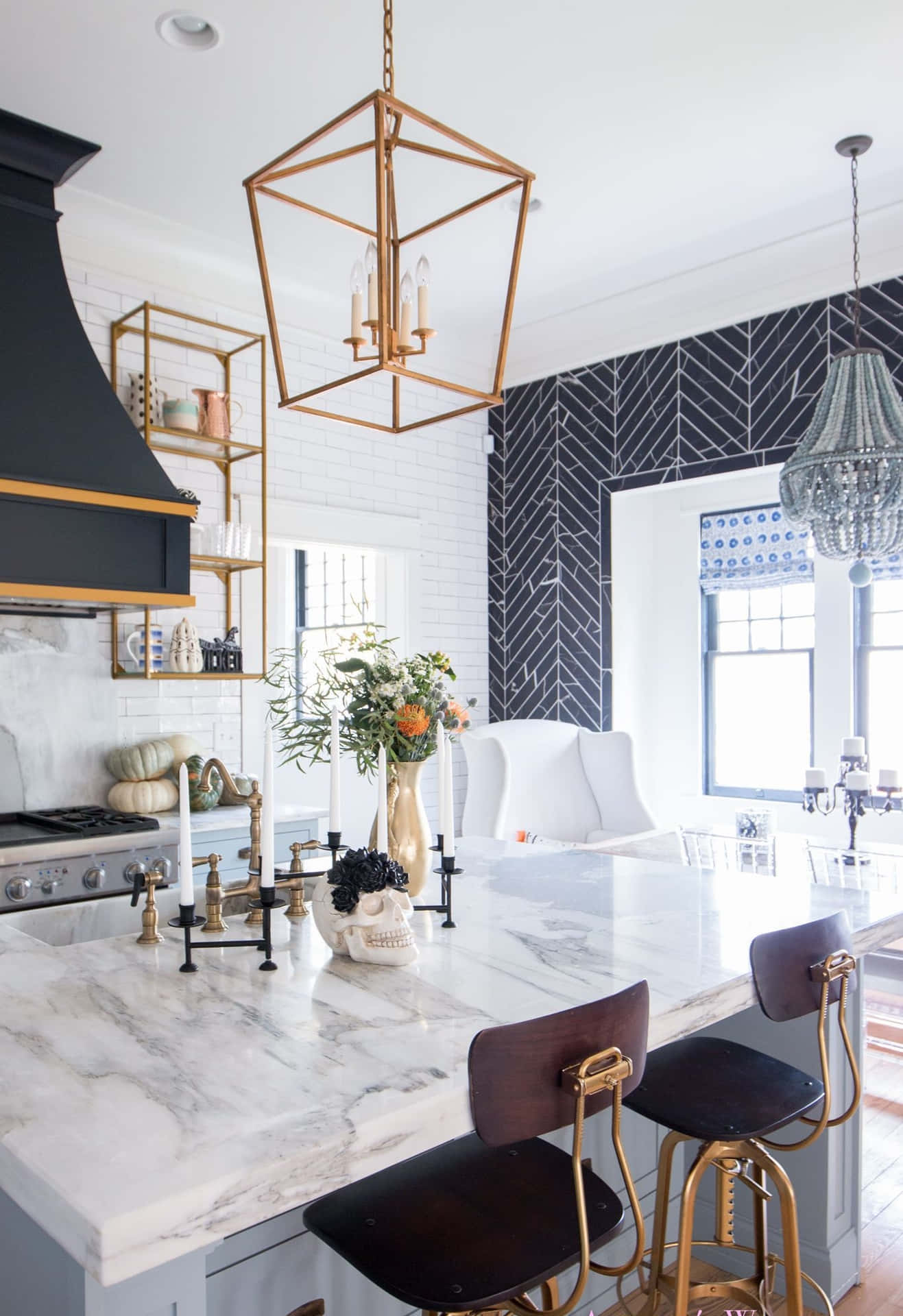 A Kitchen With A Marble Counter Top And Gold Stools Background