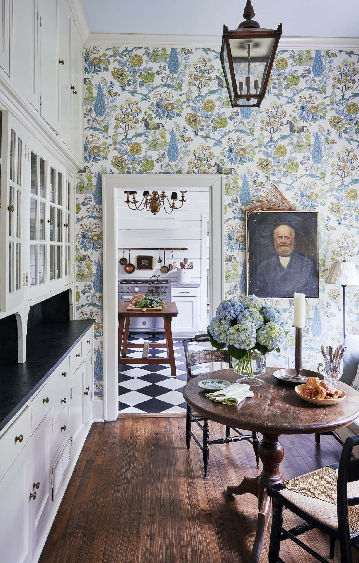 A Kitchen With Floral Wallpaper