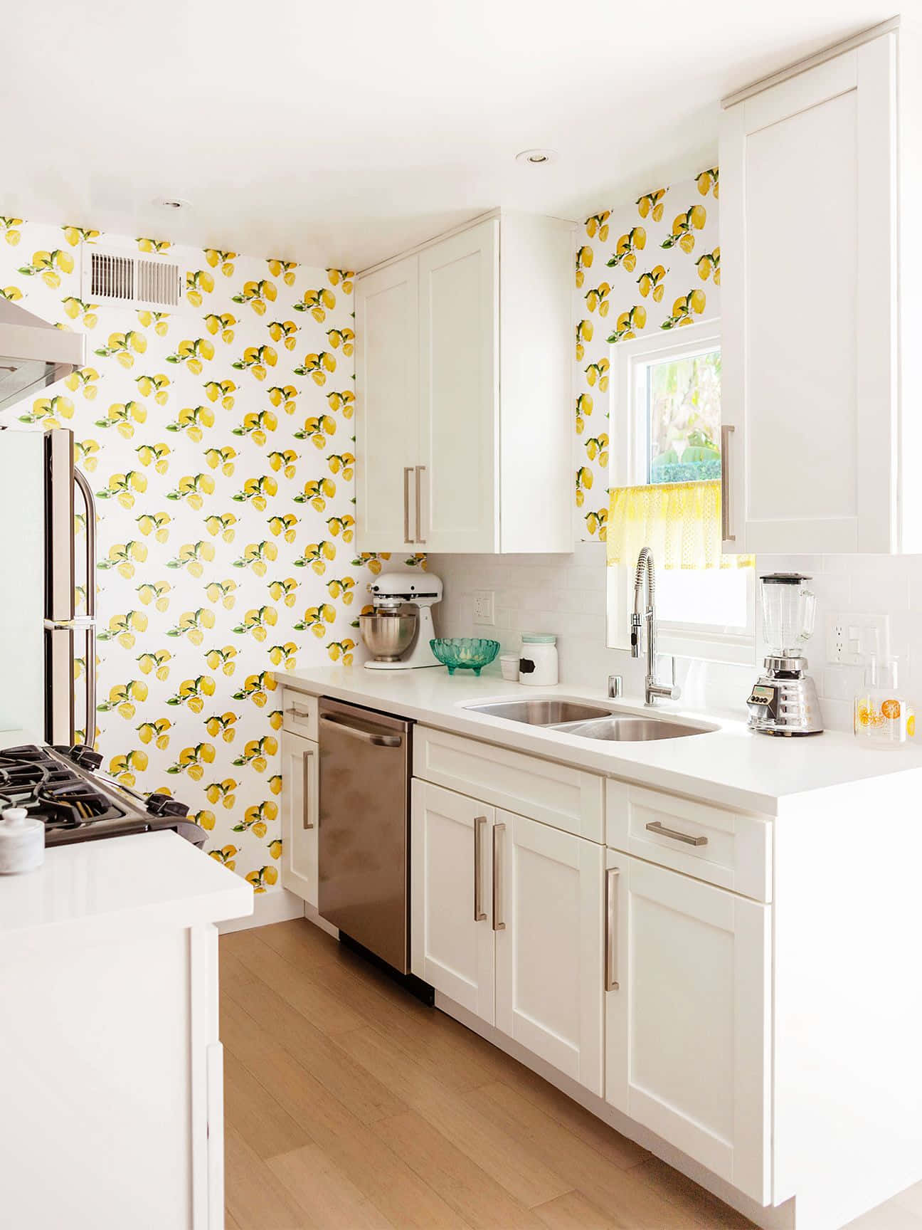 A Kitchen With Yellow And White Wallpaper Background