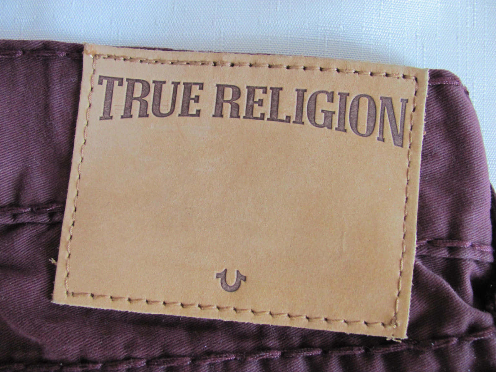 A Label On A Pair Of Pants Background