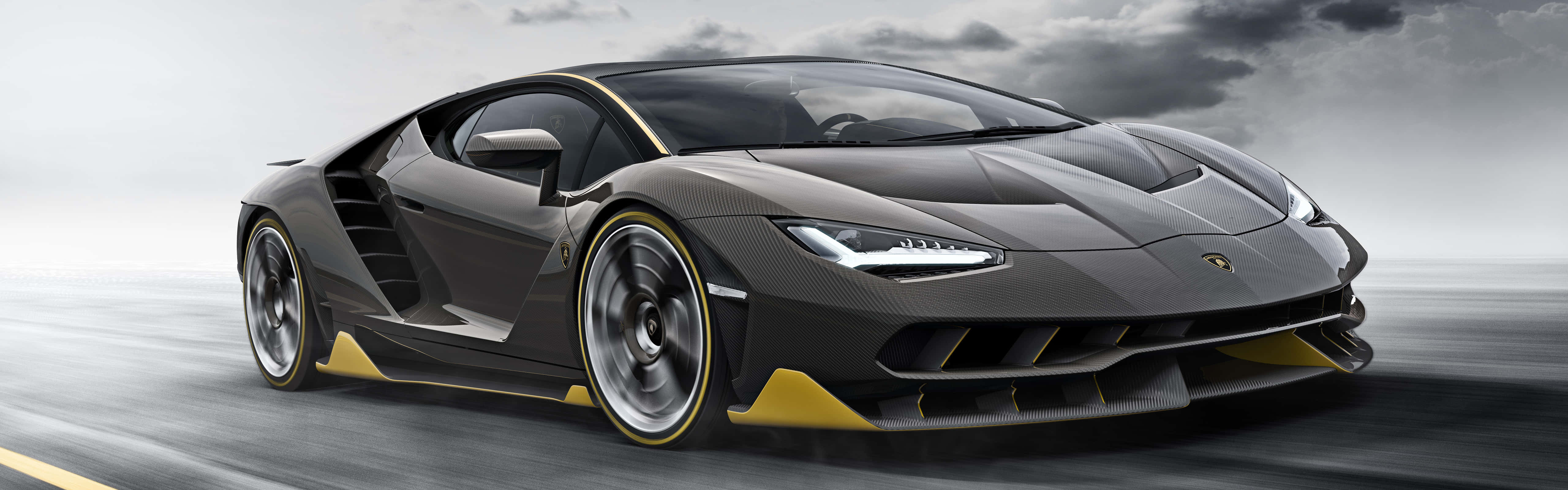 A Lamborghini Huracan Is Driving Down The Road Background