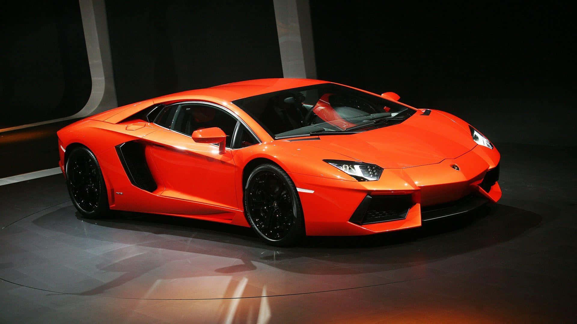 A Lamborghini Huracan Is On Display At The Auto Show Background
