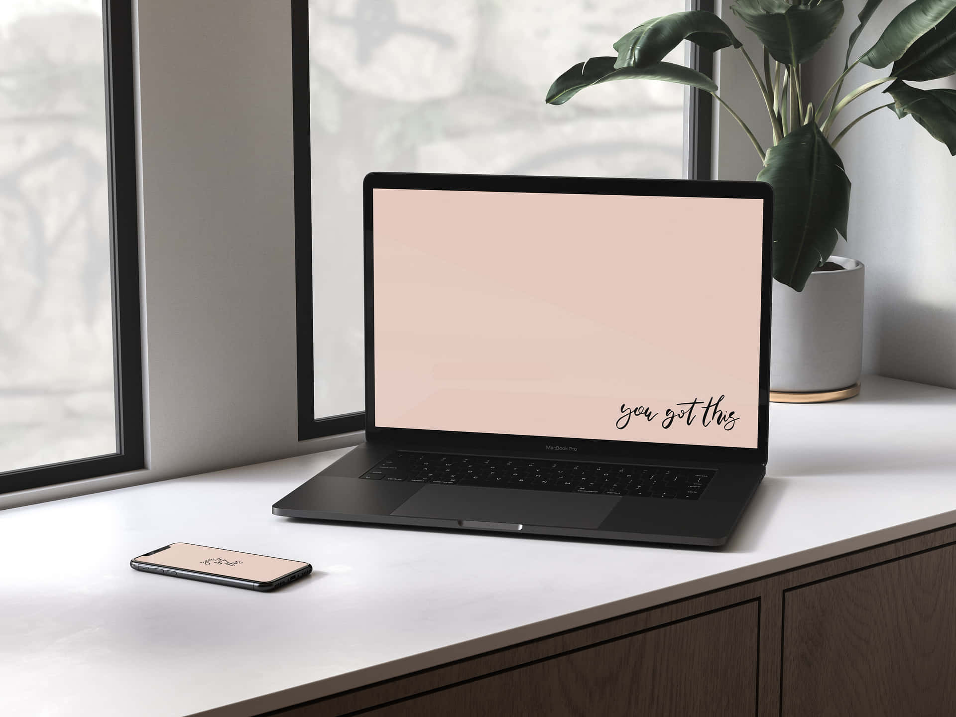 A Laptop And Phone On A Desk Next To A Window Background