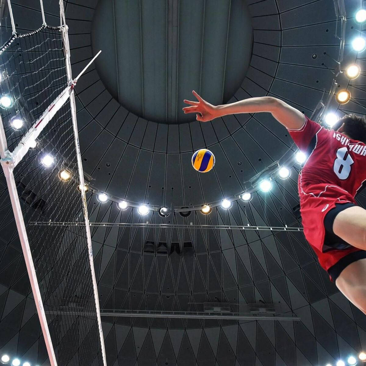 A Laptop Sits On The Court Surrounded By Volleyball Equipment Background