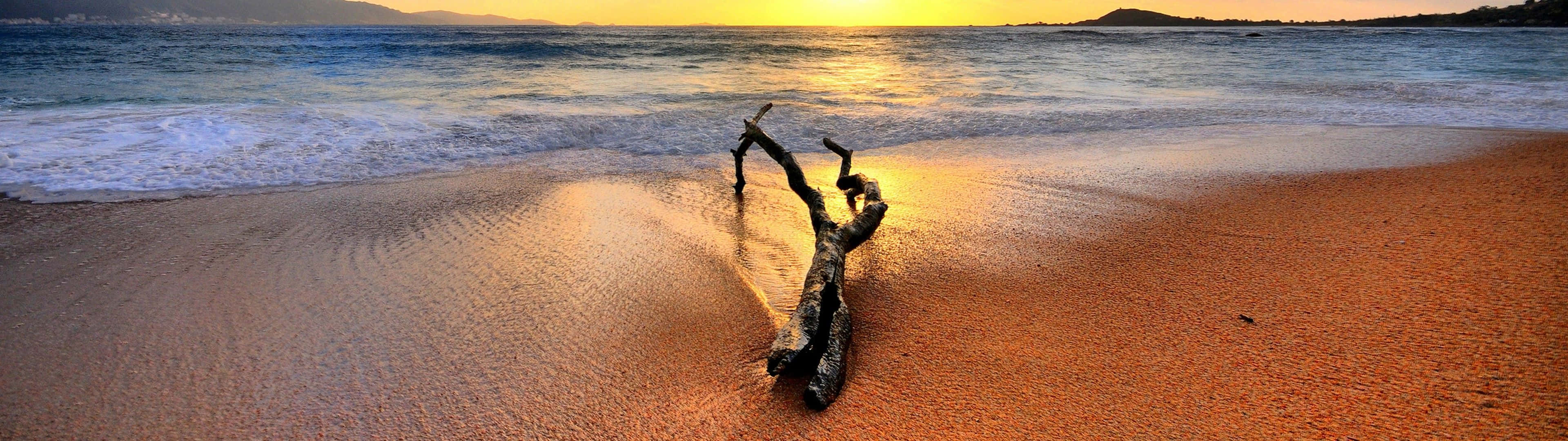 A Laptop With A Matched Dual Monitor Propped Up Against A Beach Chair. Background