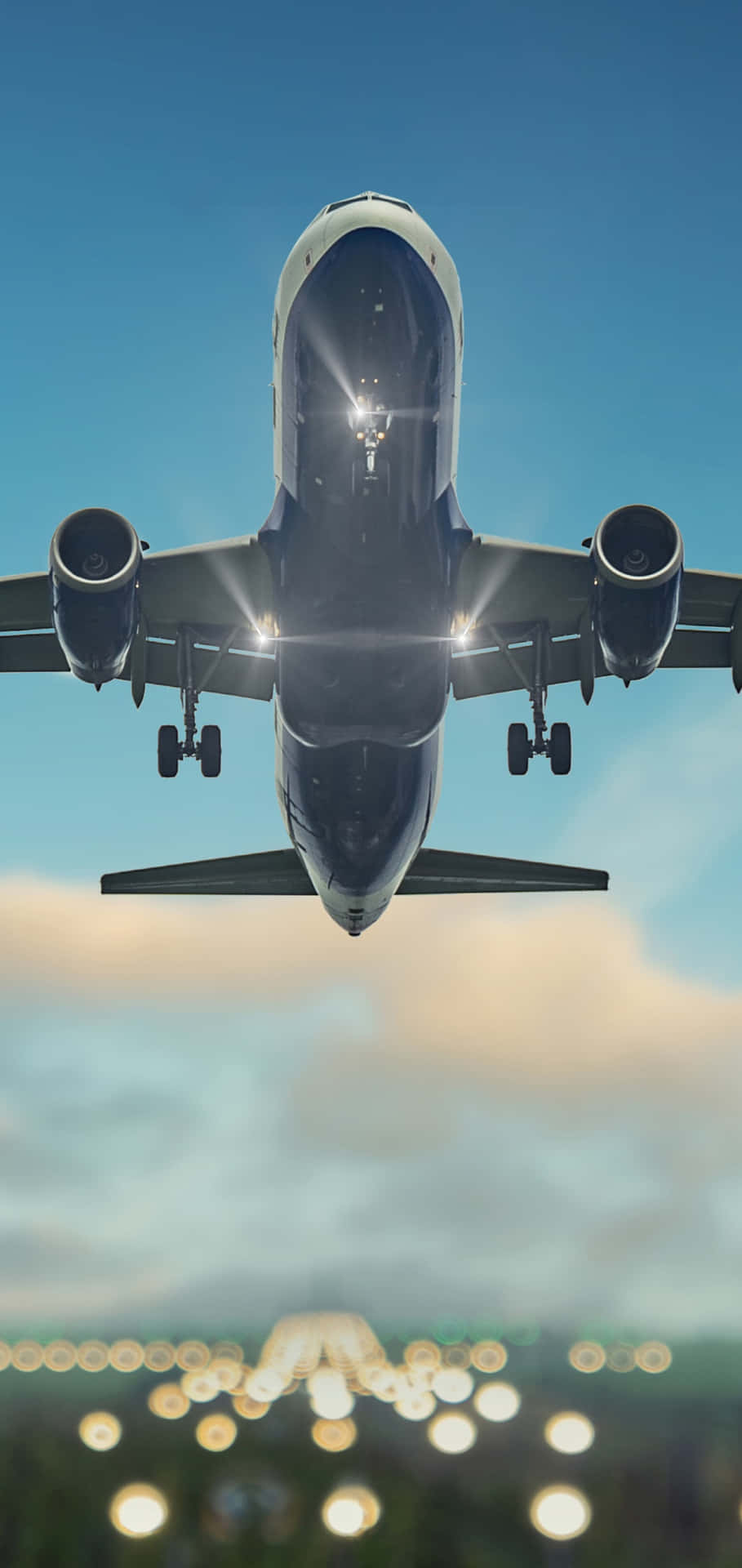 A Large Airplane Flying Over The City Background