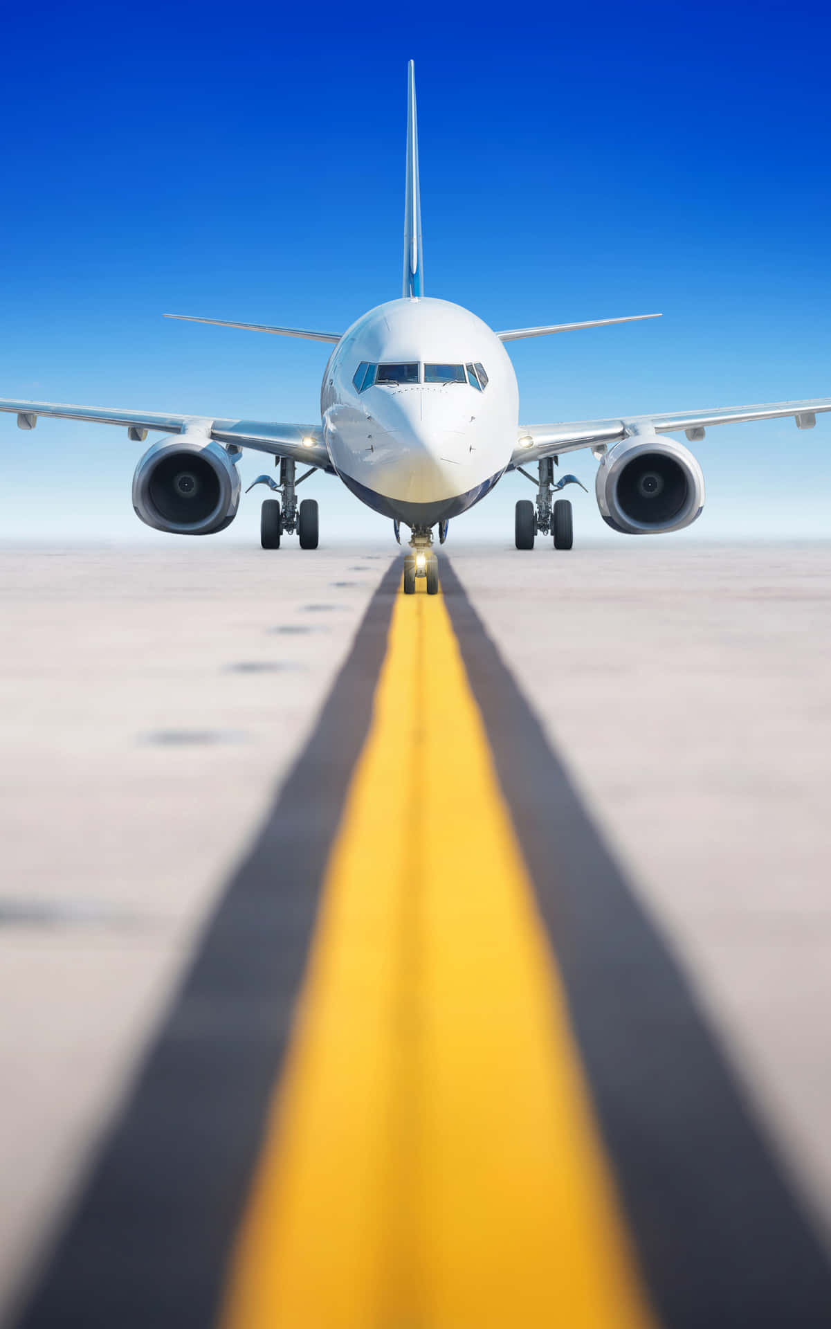 A Large Airplane Is On The Runway Background