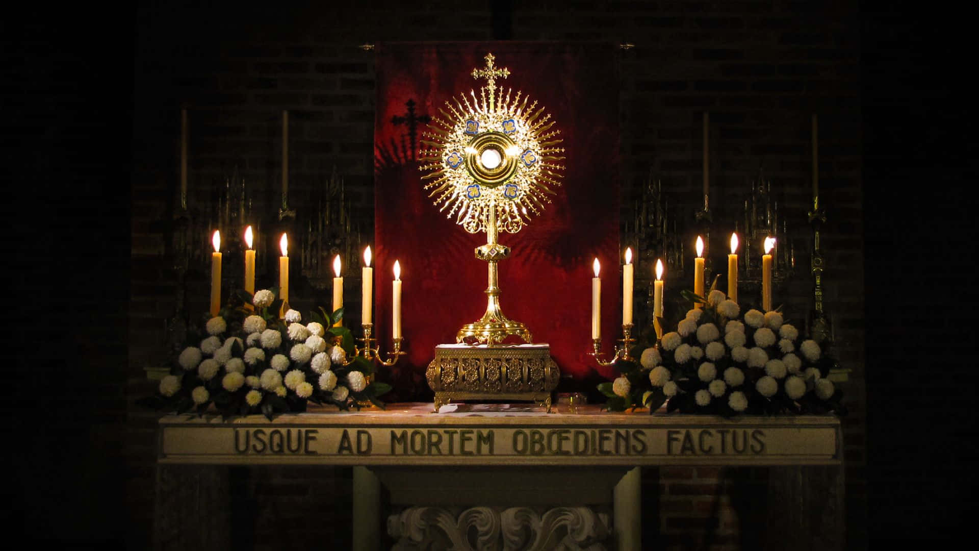 A Large Altar With Candles And Candles Background