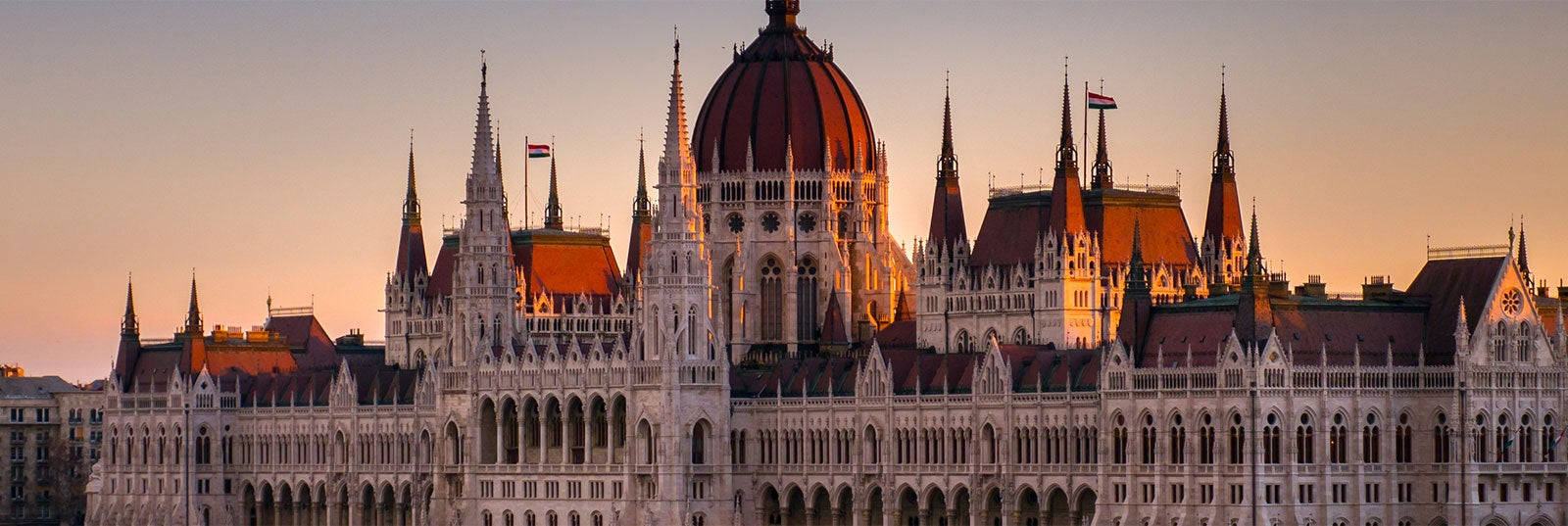 A Large Building With A Clock Tower In The Background Background