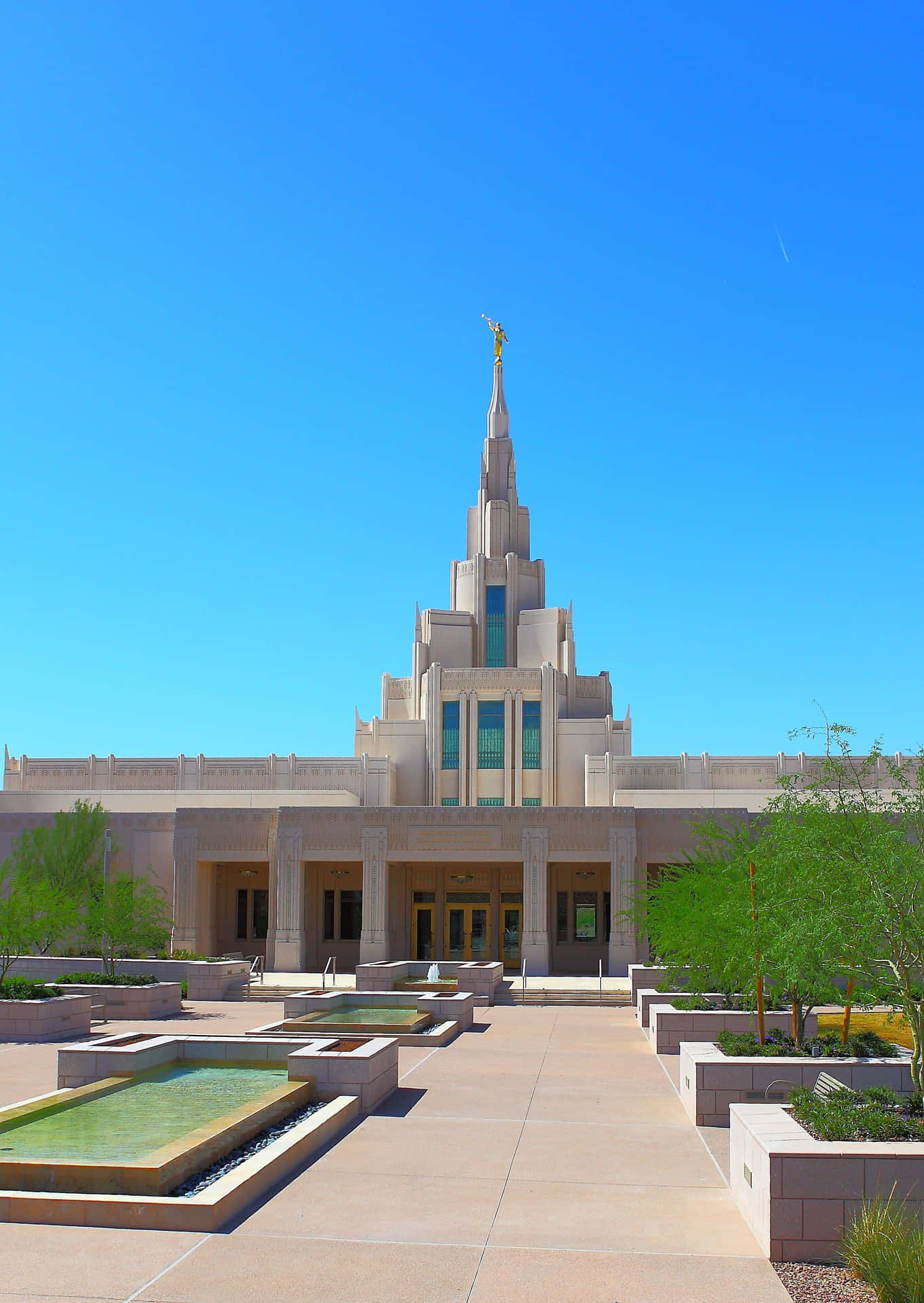 A Large Building With A Fountain Background