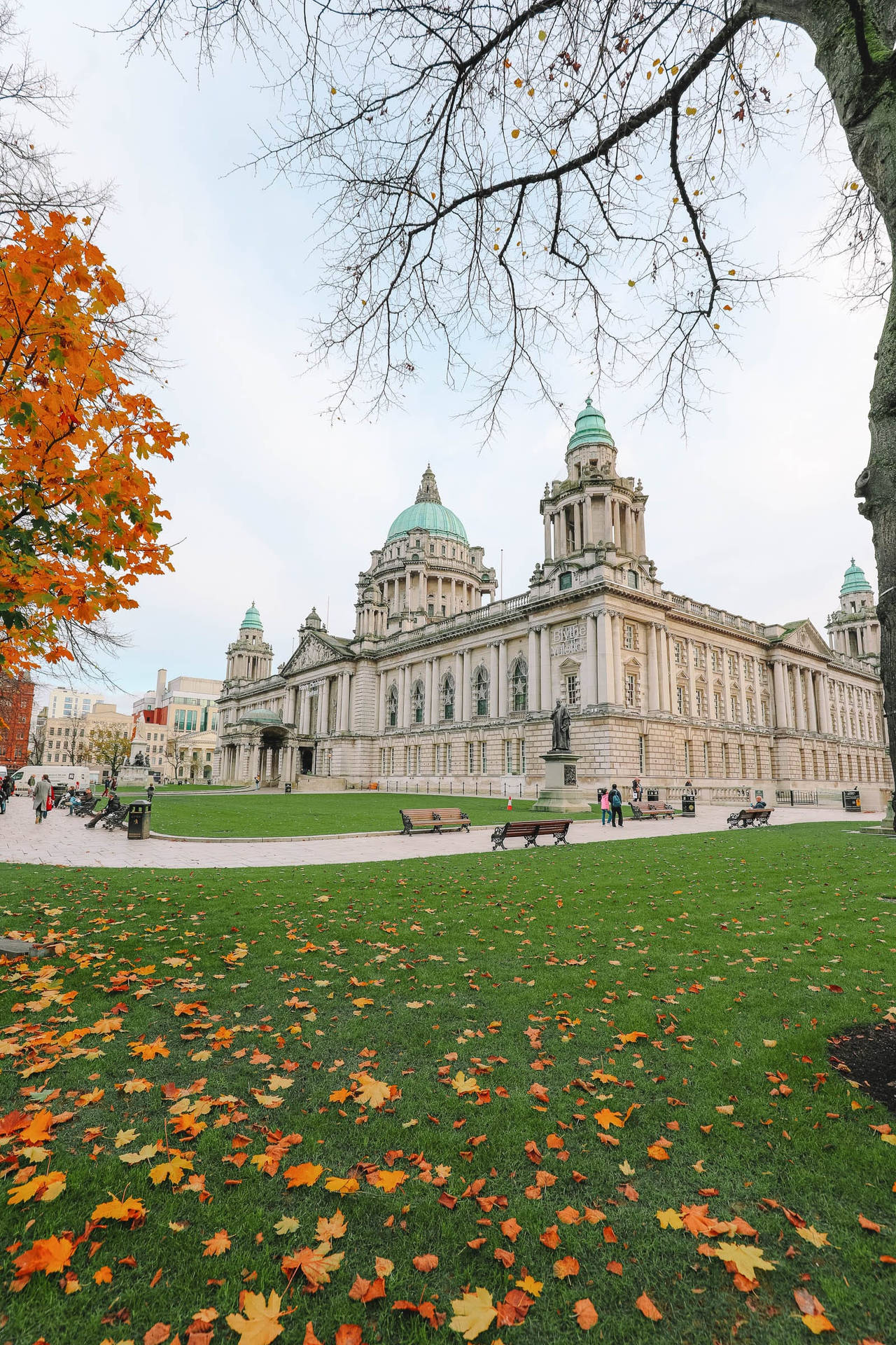 A Large Building With A Large Lawn Background