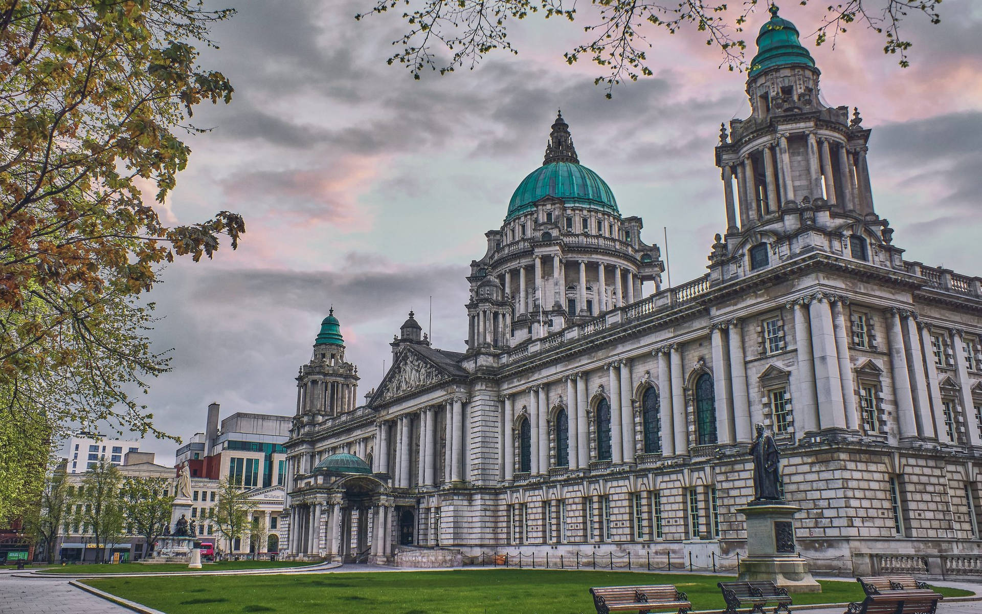 A Large Building With Green Domes Background