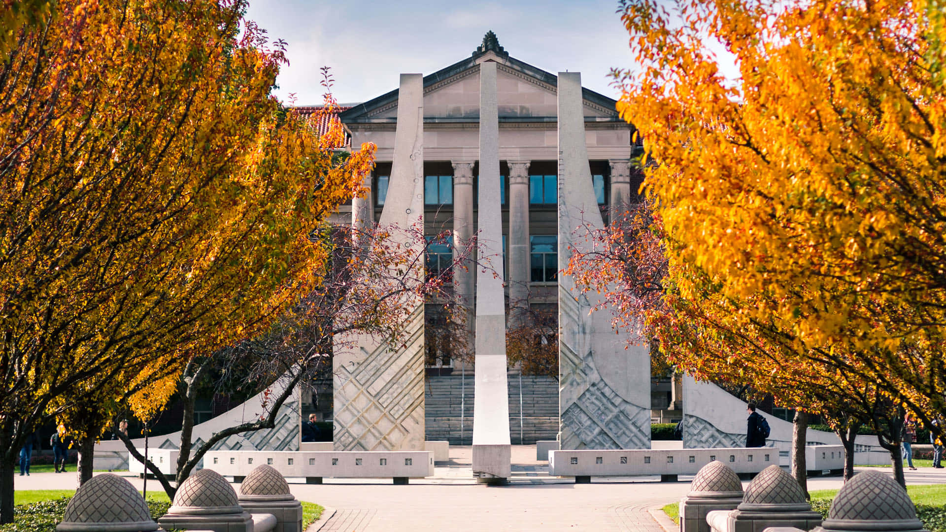 A Large Building With Trees Background