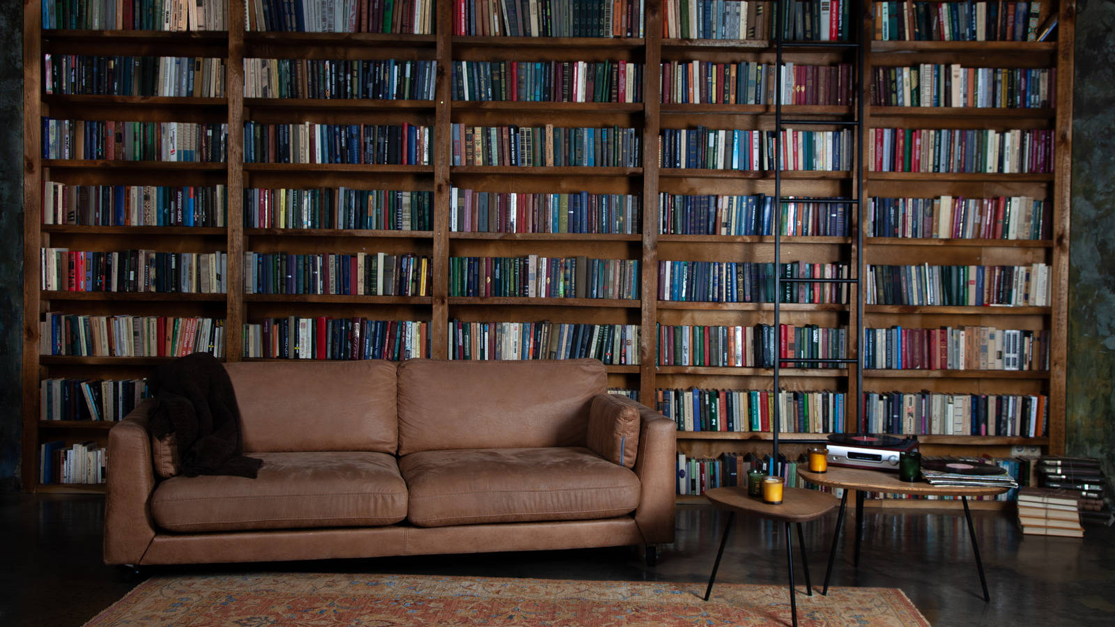 A Large Room Filled With A Grand Bookshelf