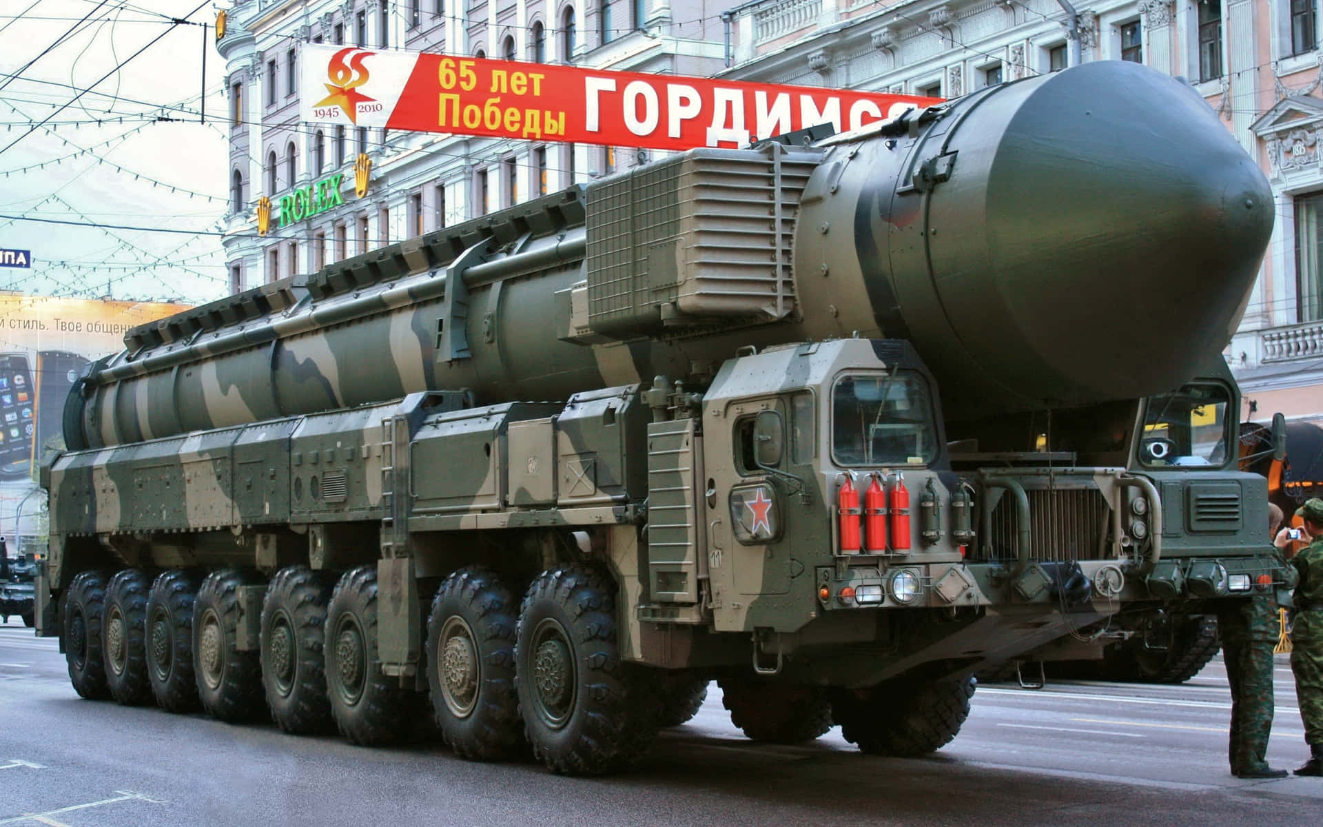 A Large Truck With A Large Missile On It