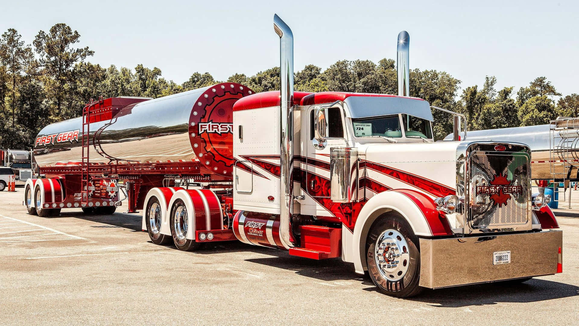 A Large Truck With A Tank Background