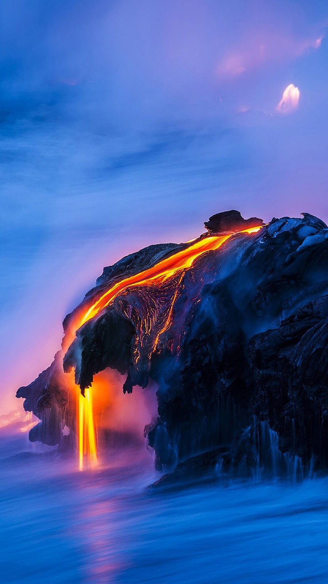 A Lava Flow Is Coming Out Of The Ocean Background