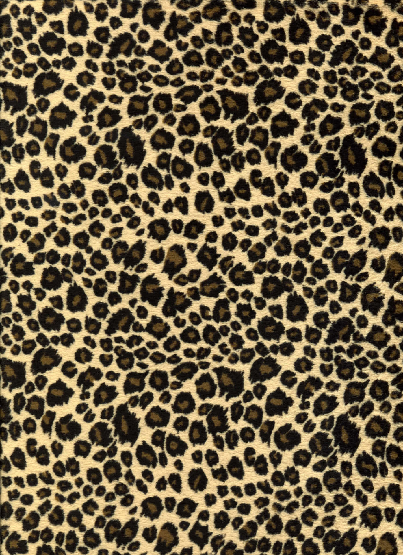 A Leopard Print Fabric With Black And Brown Stripes Background