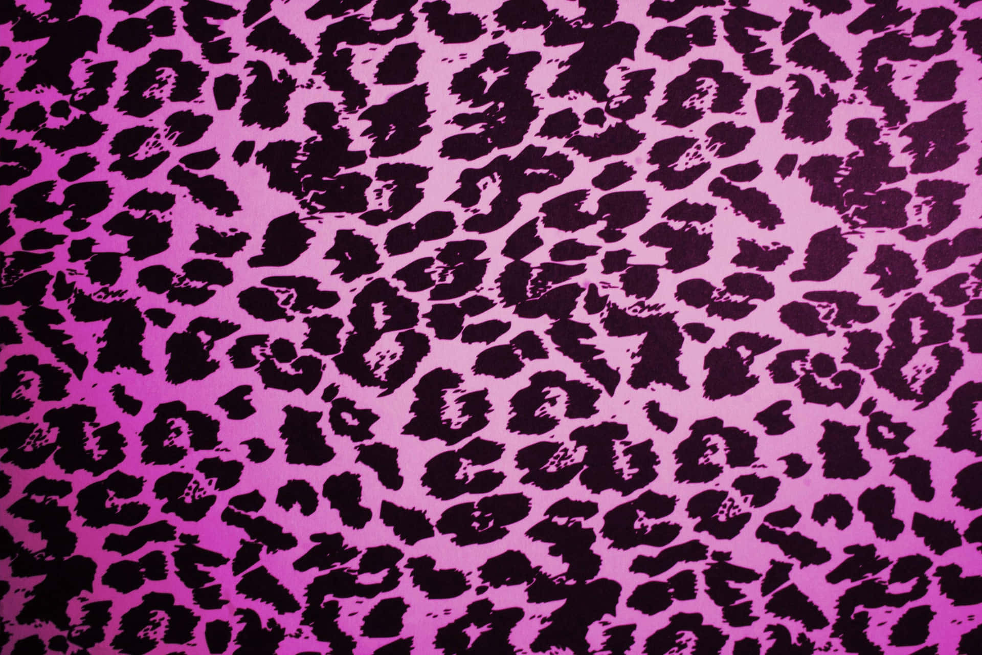 A Leopard Print Wallpaper In Pink And Black Background