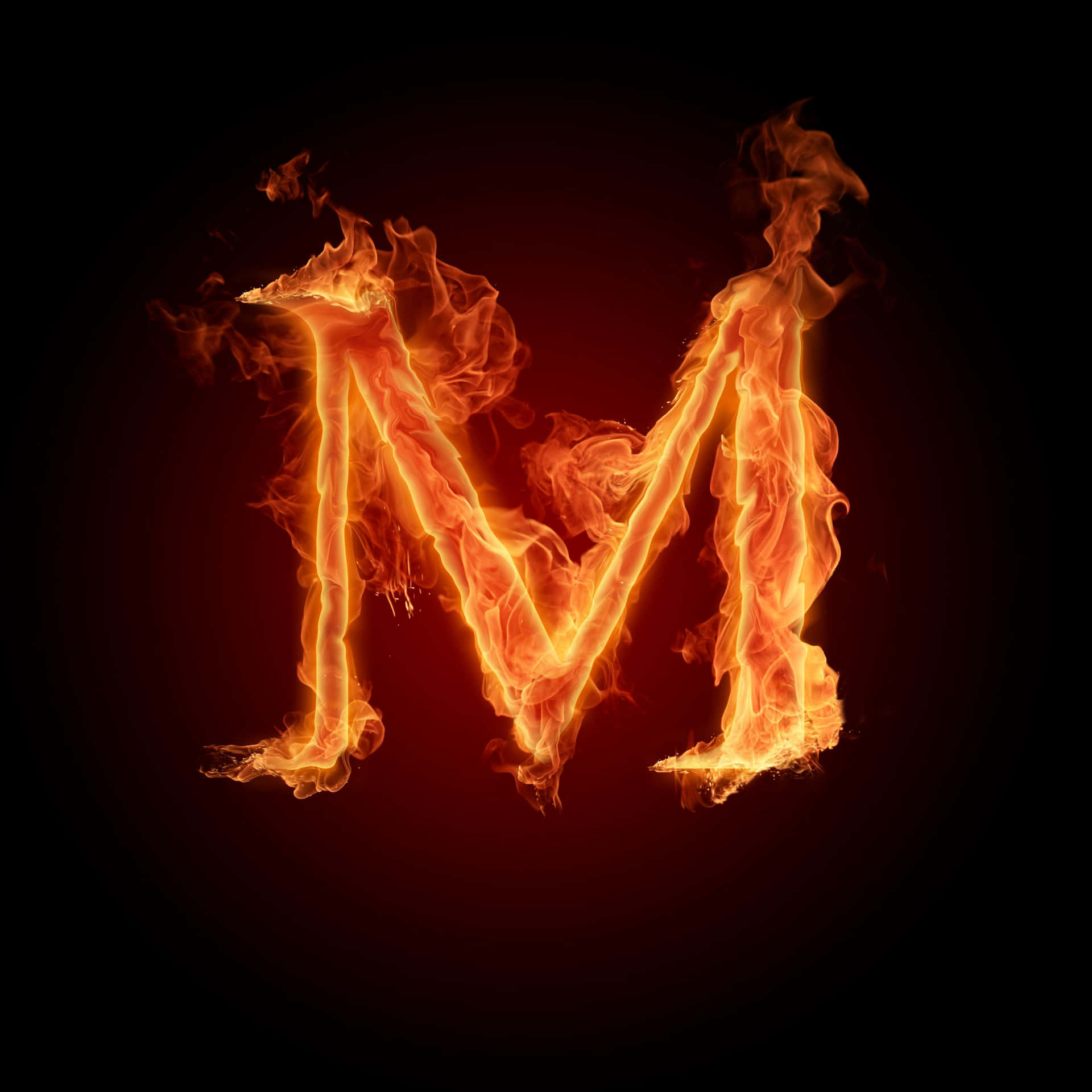 A Letter M In Fire On A Black Background Background