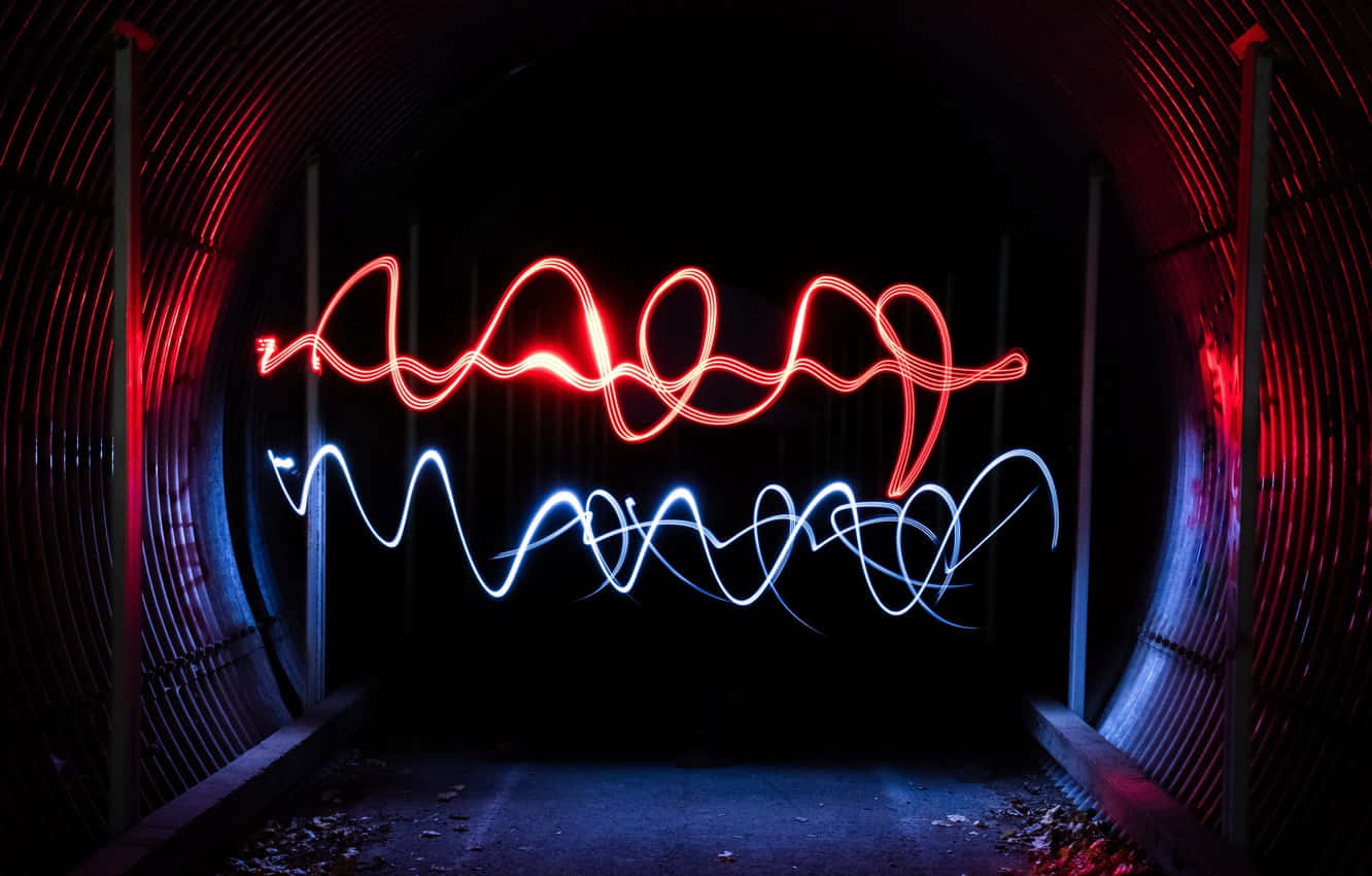 A Light Painting Of A Tunnel With Red And Blue Lights Background