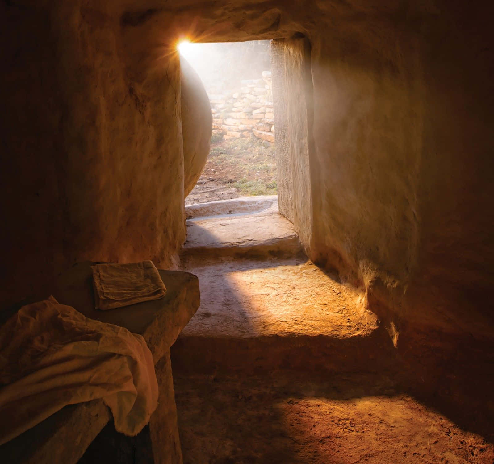 A Light Shines Through A Doorway Into A Cave Background