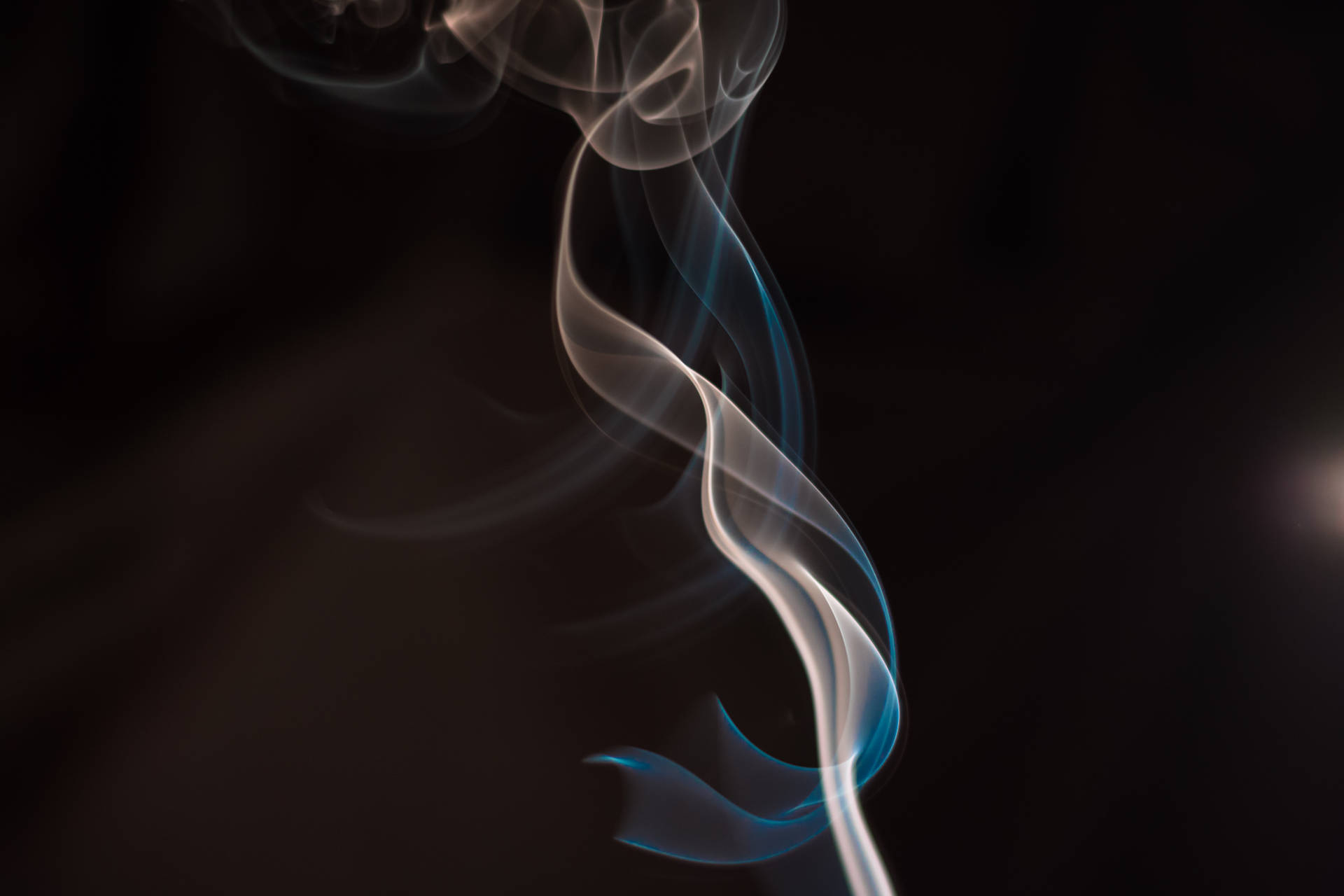 A Lighter Igniting A Cigarette Background