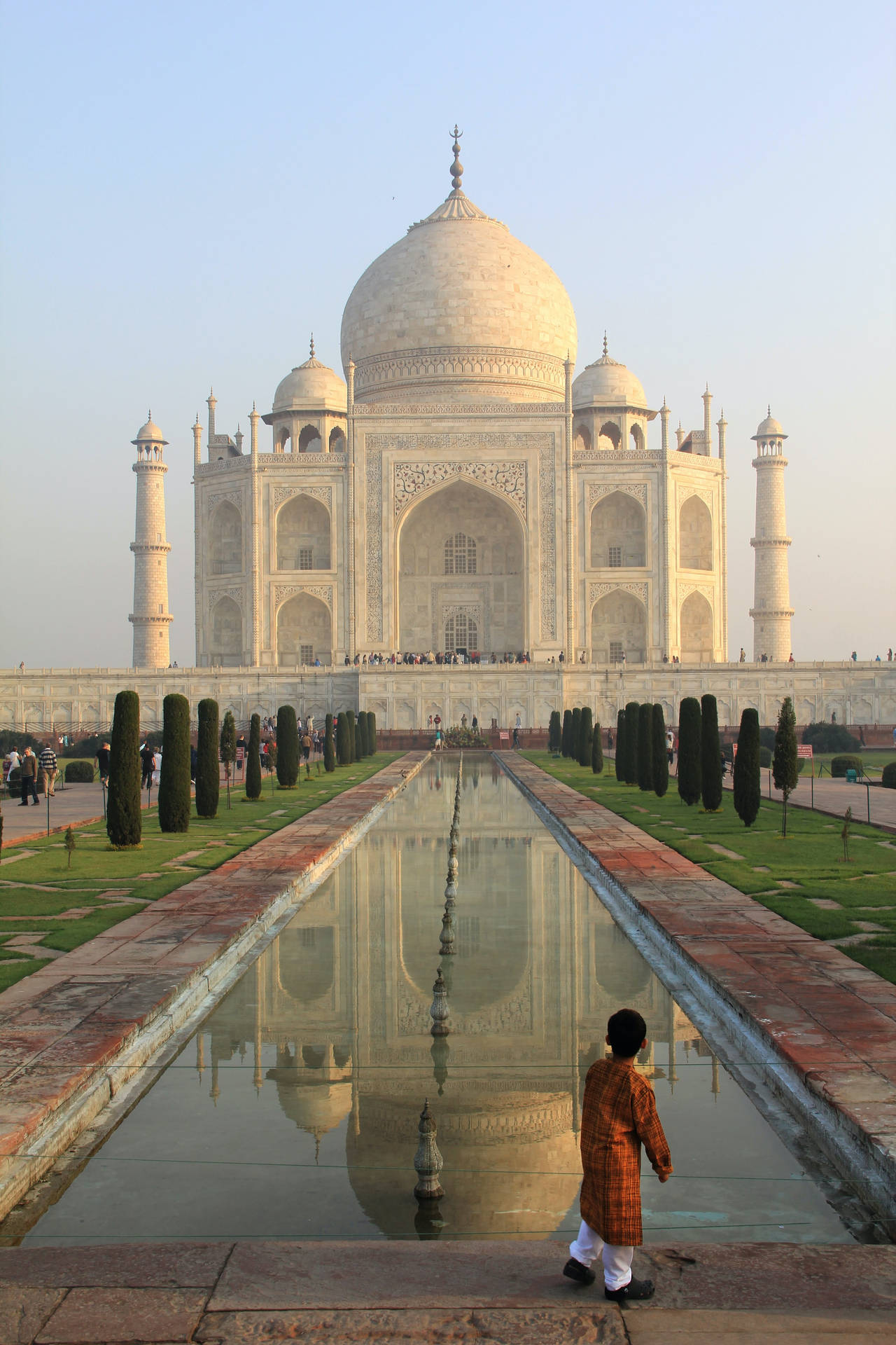 A Little Boy In The Taj Mahal Background