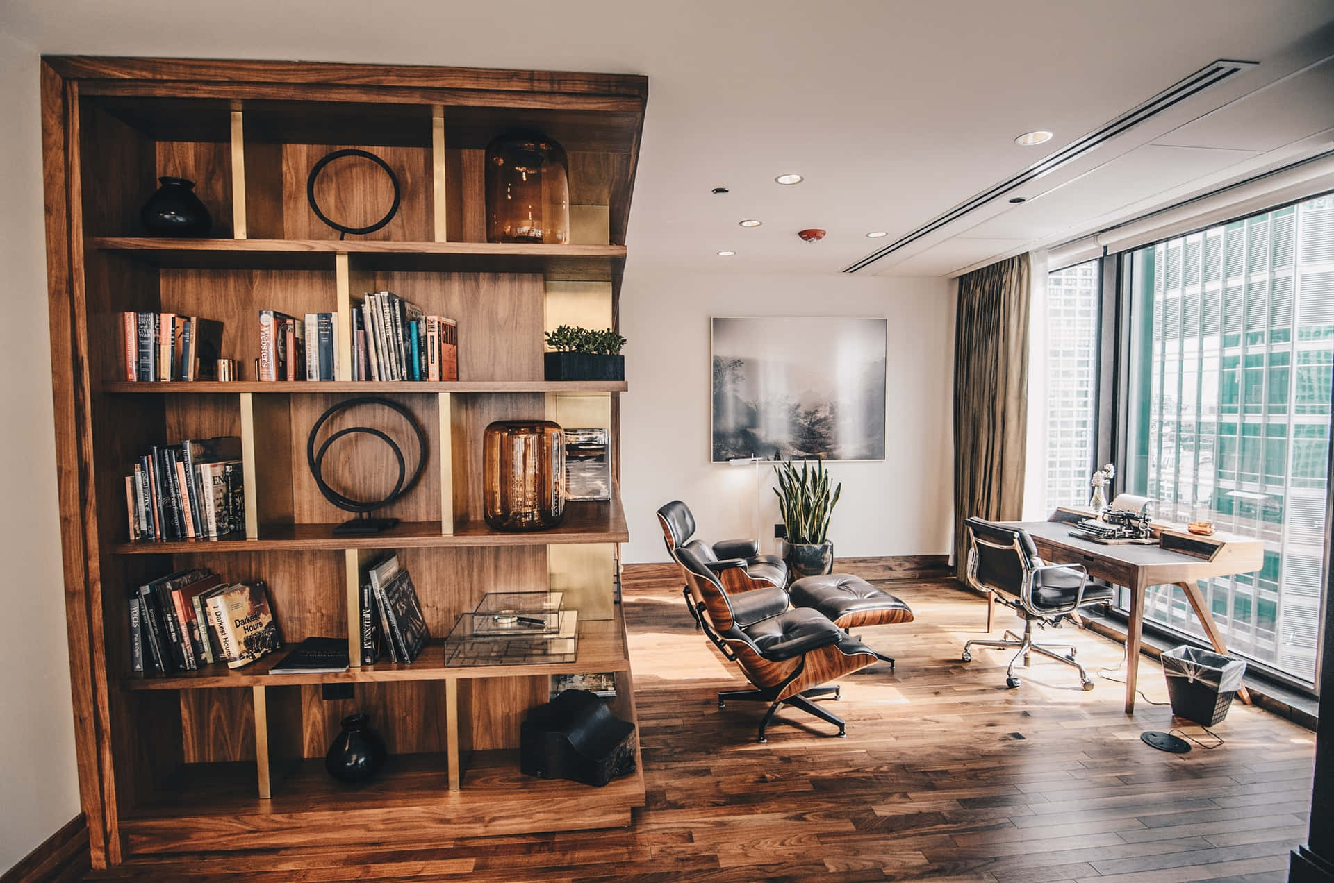 A Living Room With A Bookcase And A Chair Background