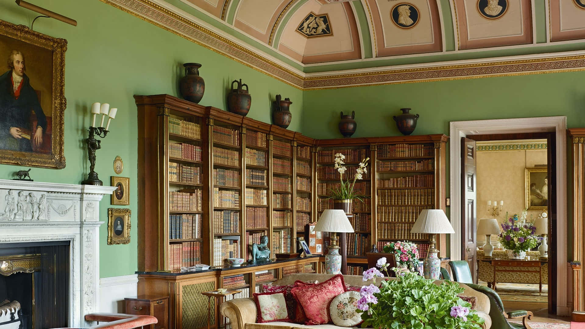 A Living Room With A Fireplace And Bookshelves Background