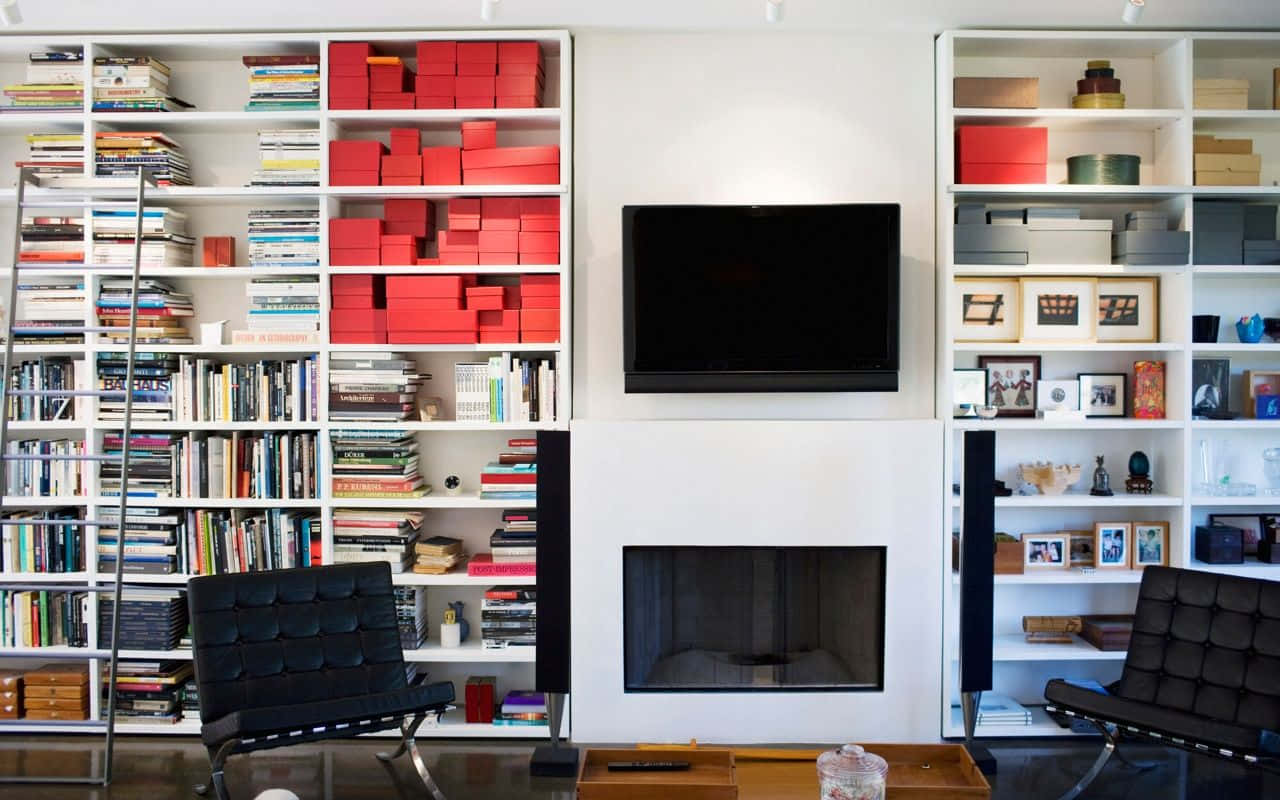A Living Room With A Fireplace And Bookshelves Background