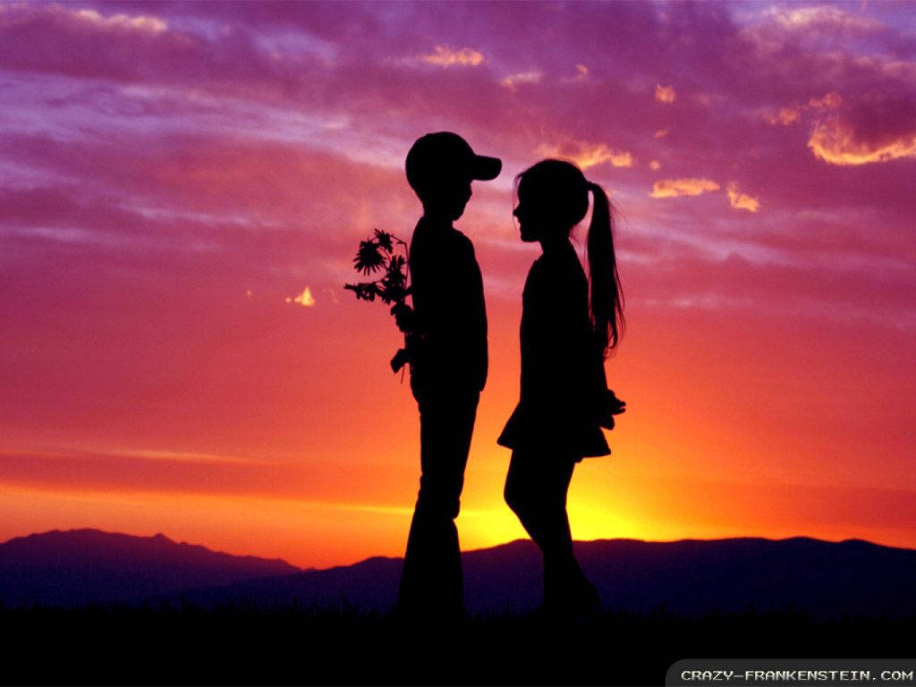 A Loving Couple Seize The Stunning Sunset
