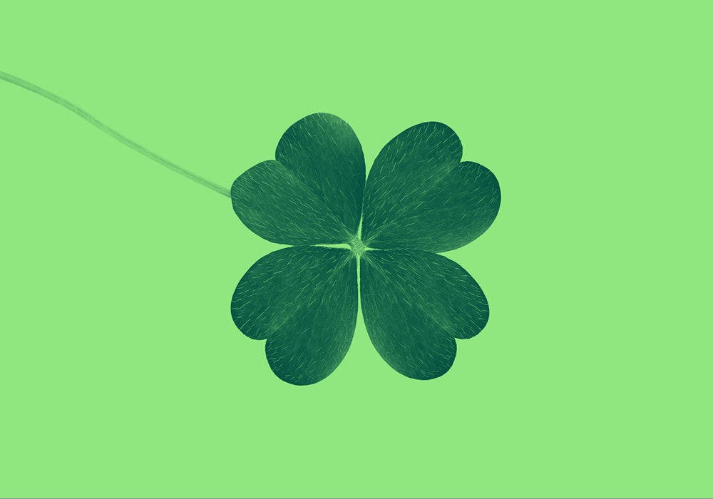 A Lucky Golden Four-leaf Clover Background